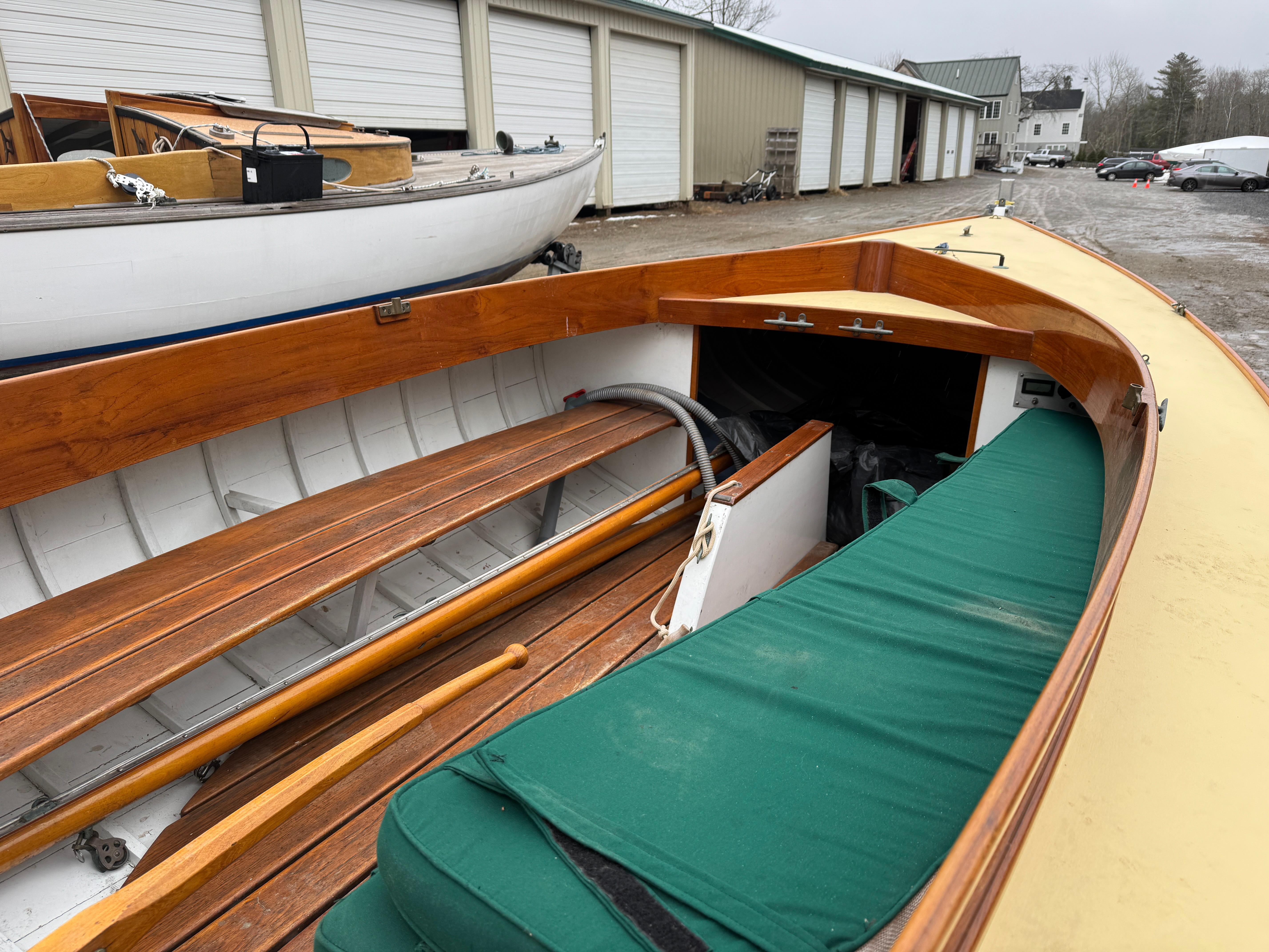 Herreshoff Watch Hill 15 sailboat, 1994 model, with wooden interior and green cushions.