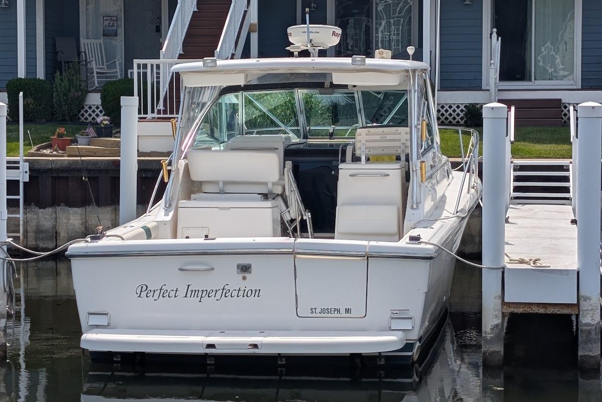 2000 Pursuit 3400 Express boat docked, named "Perfect Imperfection," in St. Joseph, MI.