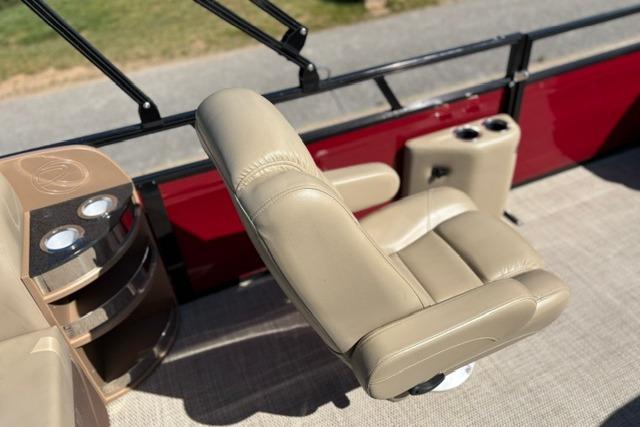 Luxurious seating on 2025 Regency 250 DL3 pontoon boat with beige upholstery.