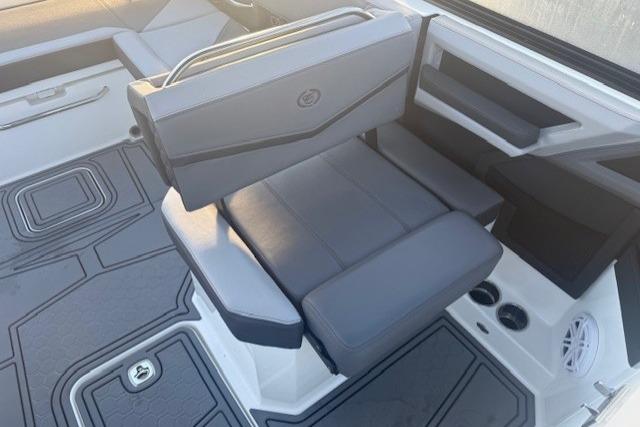 2023 Cobalt R6 Surf boat interior with gray seating and modern design.