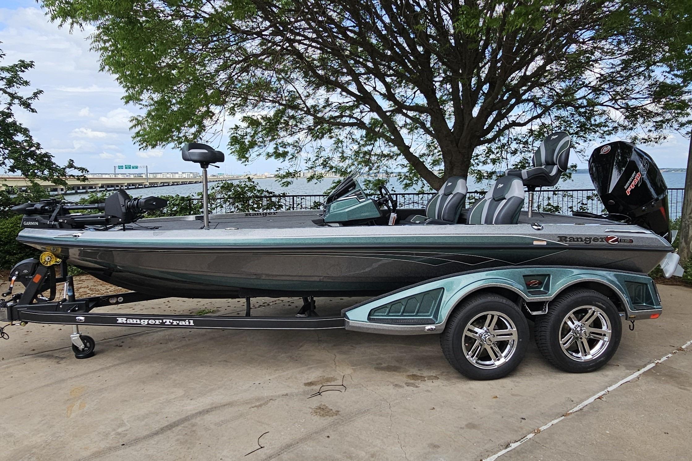 2026 Ranger Z519R Cup-Equipped boat on trailer, parked near a scenic lakeside.
