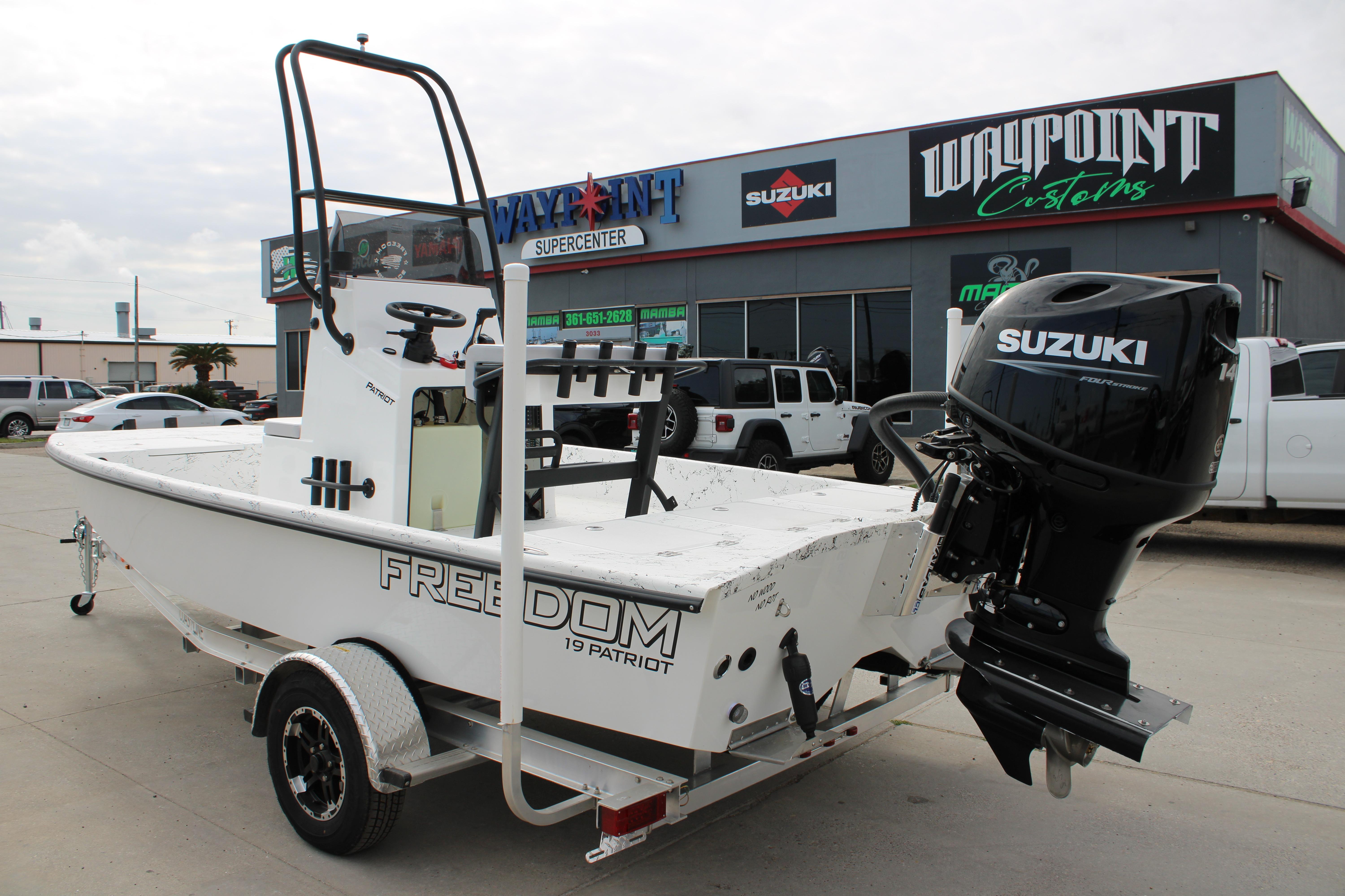 2026 Freedom Boats 19 PATRIOT with Suzuki engine at dealership.