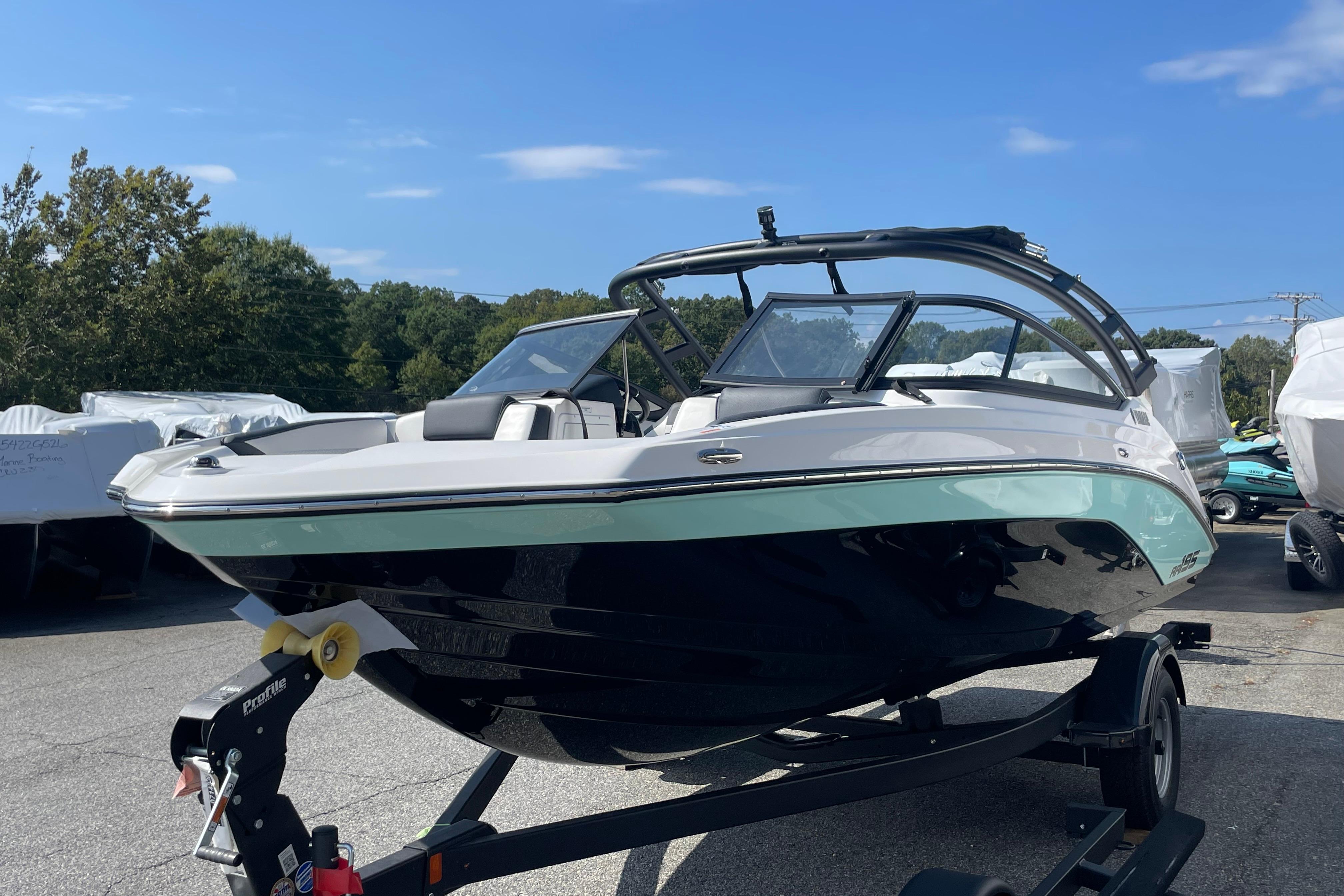 2026 Yamaha Boats AR195 on trailer, sleek design under clear blue sky.