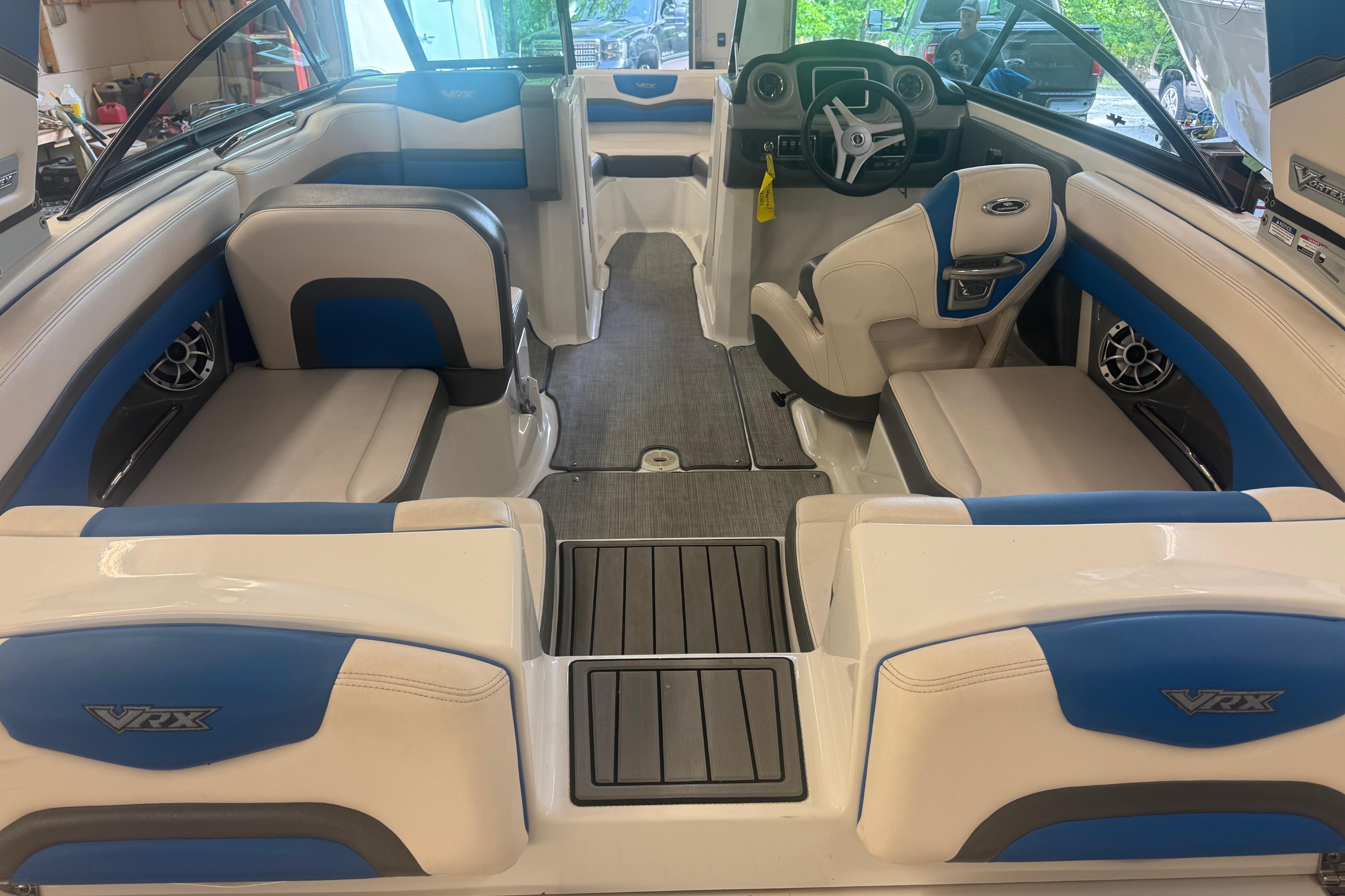 Interior of a 2017 Chaparral Vortex 203 VRX boat with blue and white seating.