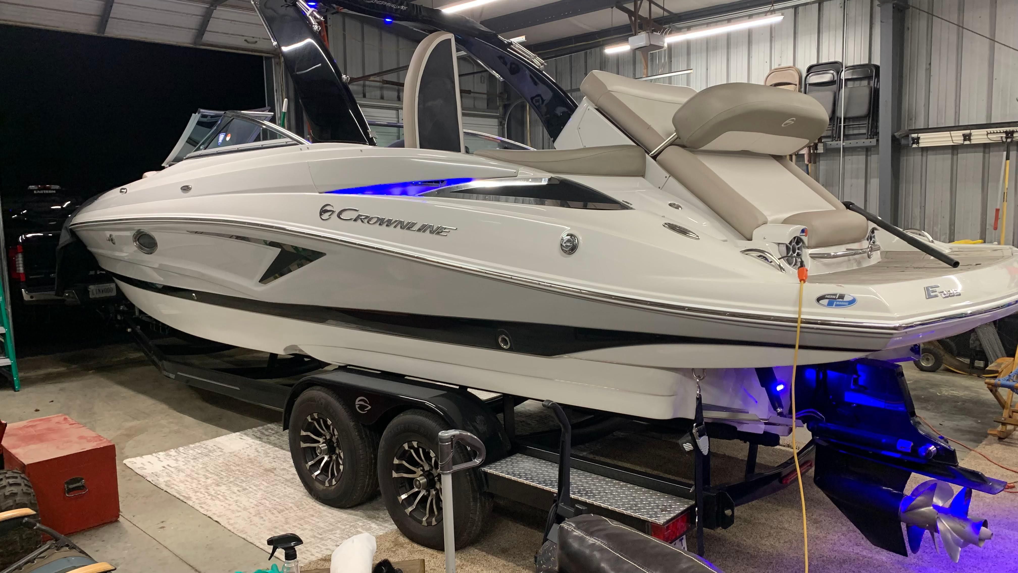 2019 Crownline E 285 in a storage facility on a trailer.