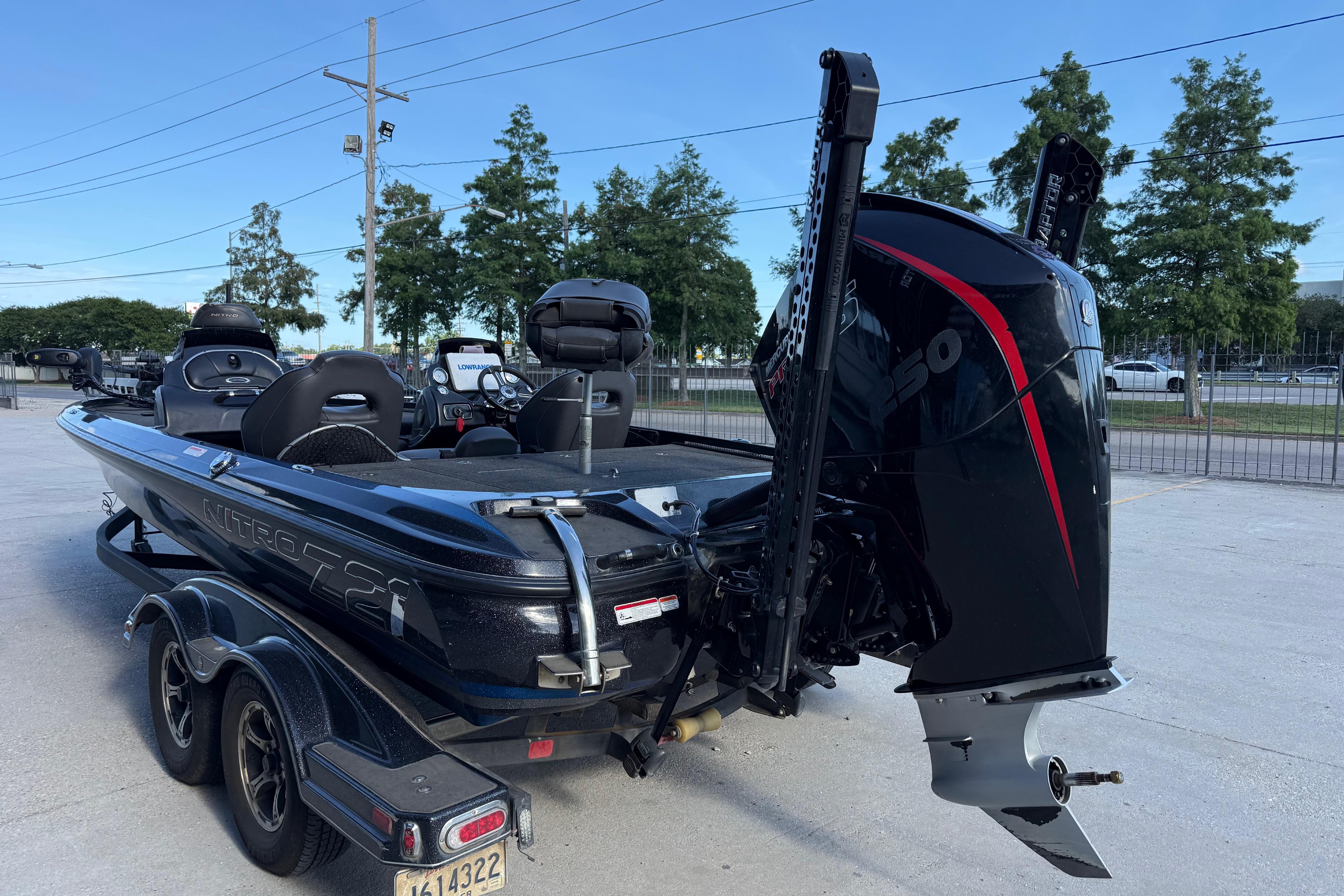 2018 Nitro Z21 boat with powerful outboard motor, parked on a trailer.