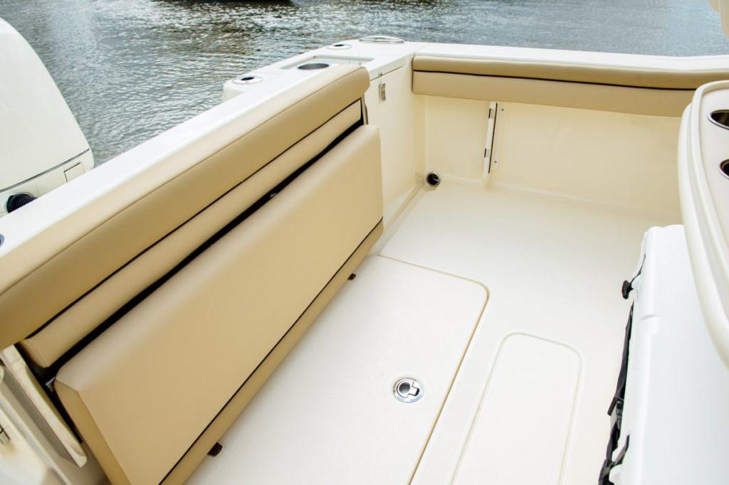 Manufacturer Provided Image: 2025 Scout 215 XSF boat interior with beige seating and storage.