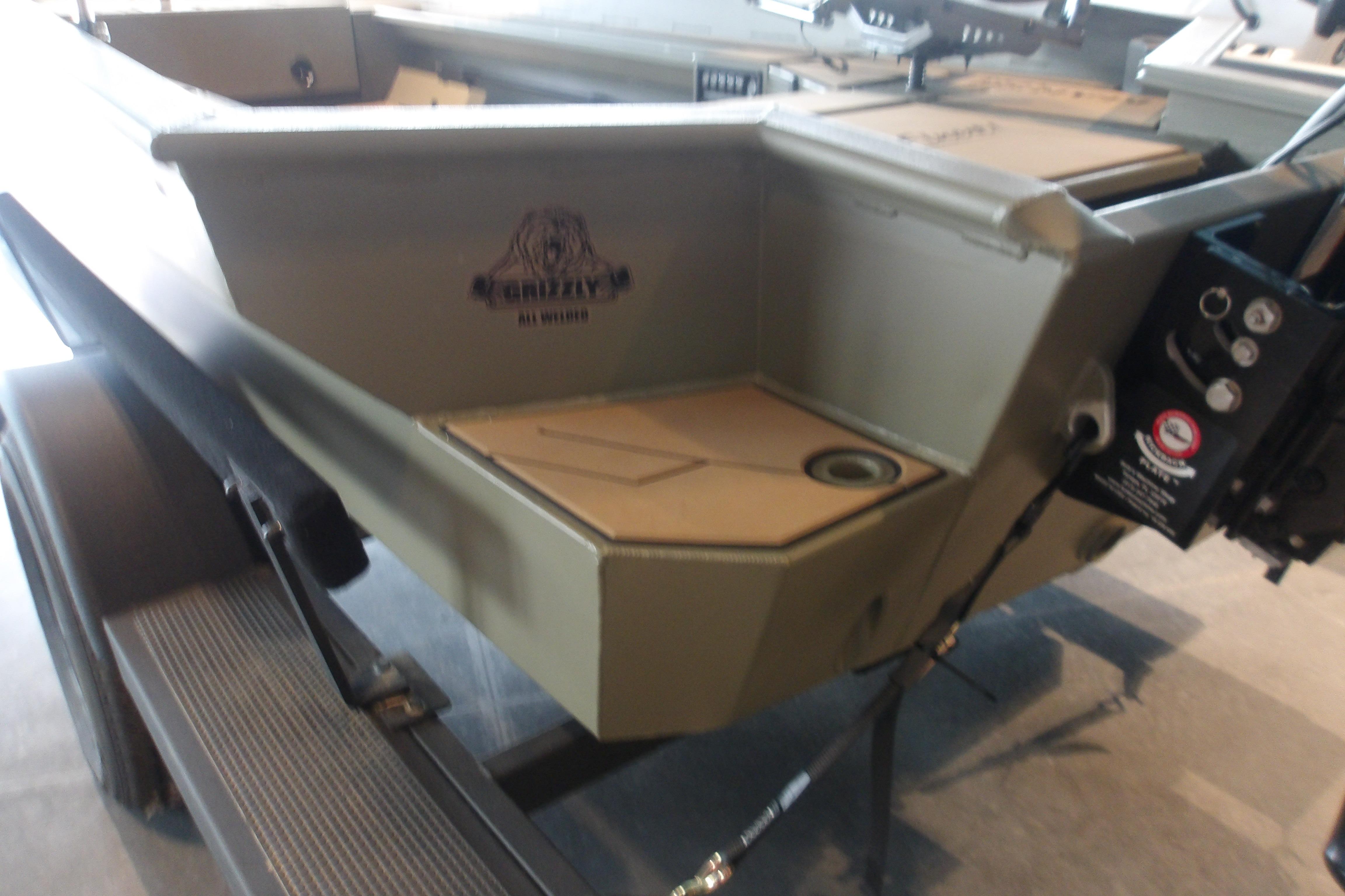 2026 Tracker Grizzly 1756 T Marsh boat, rear view, showcasing sturdy design and features.