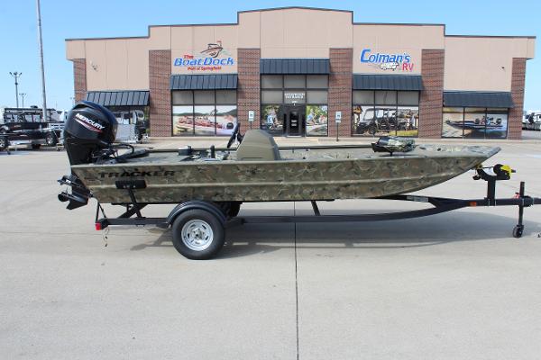 2024 Tracker Grizzly 1754 SC boat on trailer outside dealership.