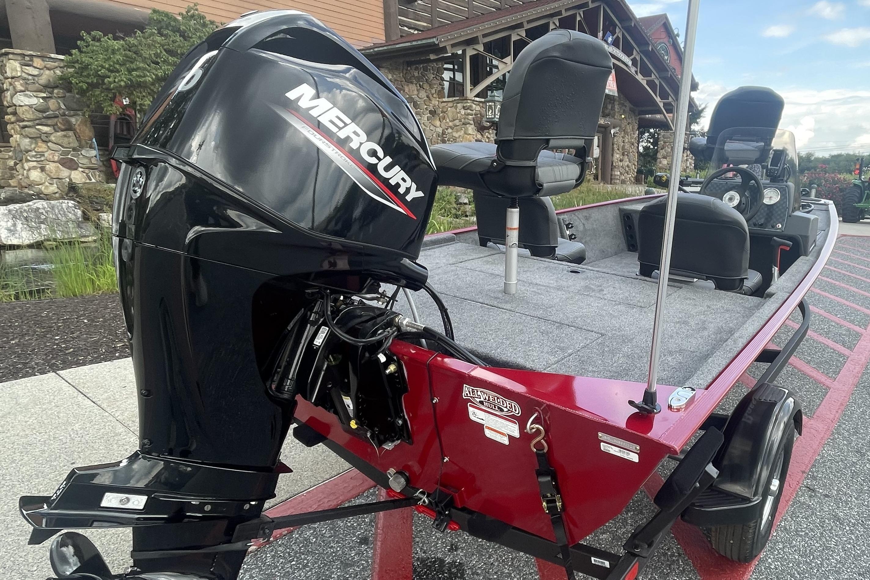 2026 Tracker Bass Tracker Classic XL boat with Mercury outboard motor, parked outdoors.