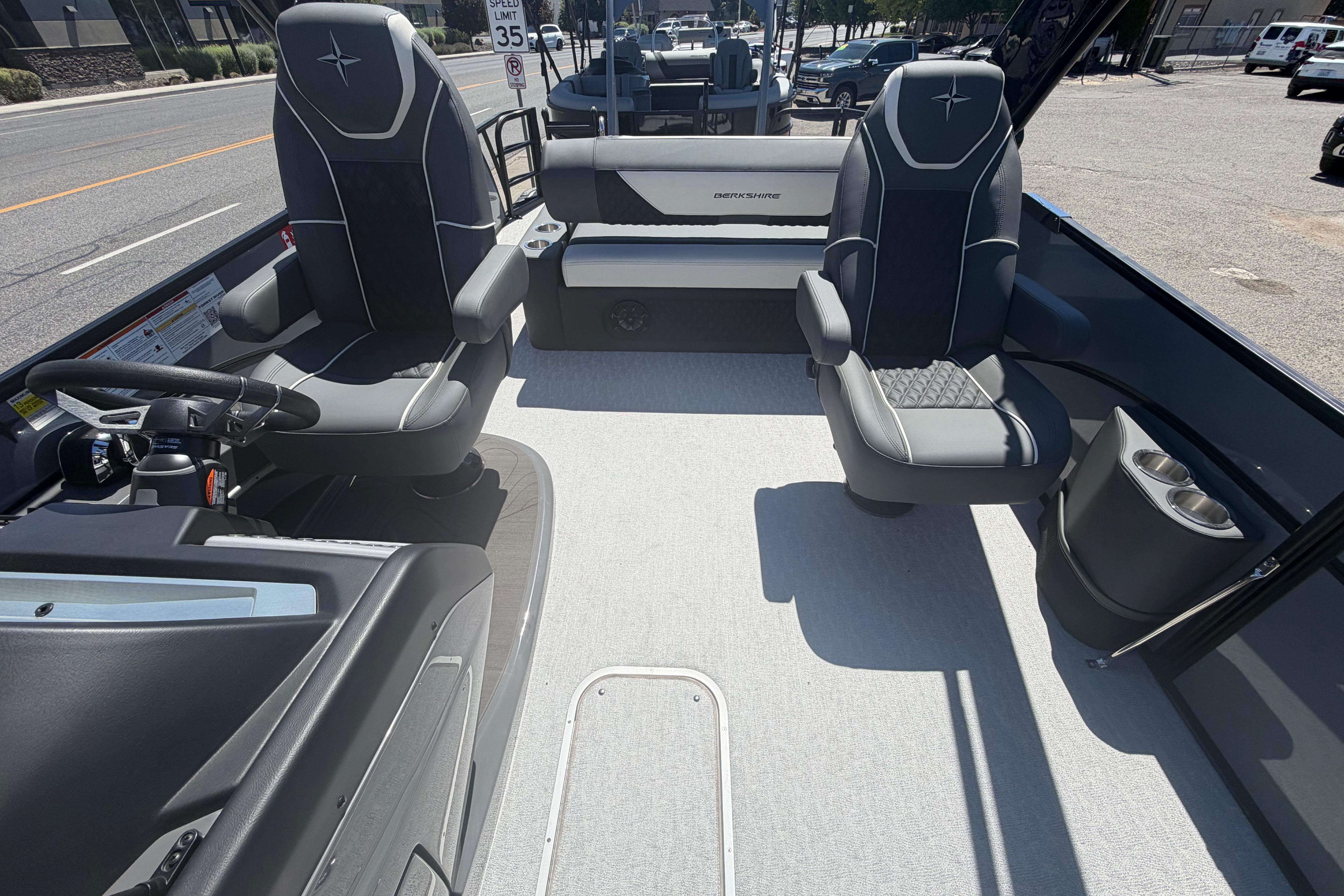 2026 Berkshire STS 23 Ultra Lounger SportArch interior with modern seating and steering console.