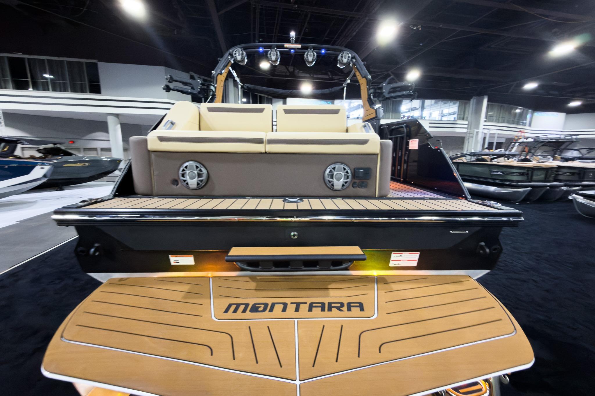 2026 Montara Surf Boss EVO SLDH 25' boat, rear view with seating and speakers.