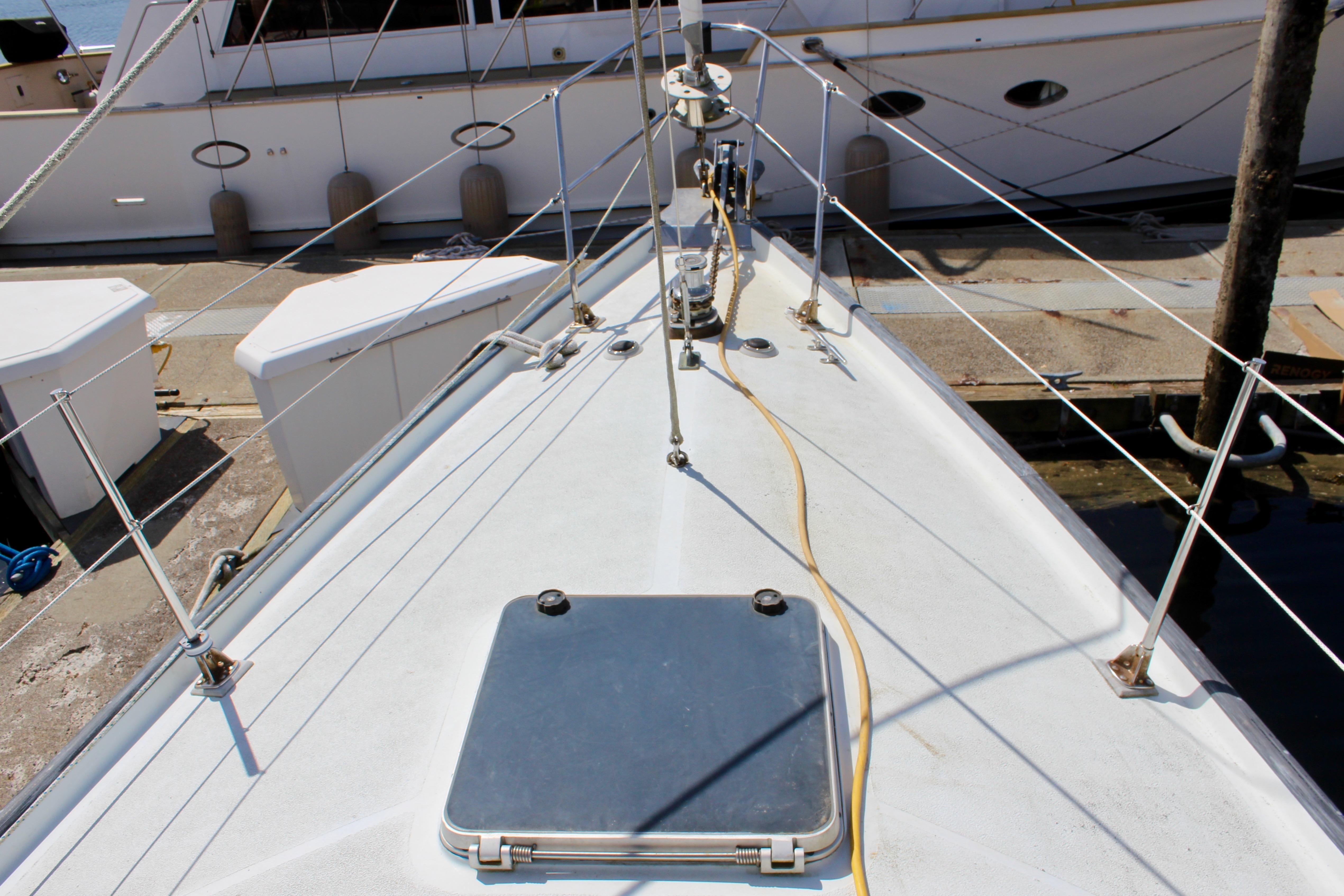 Deck view of a 1993 Freya 39 sailboat docked at a marina.