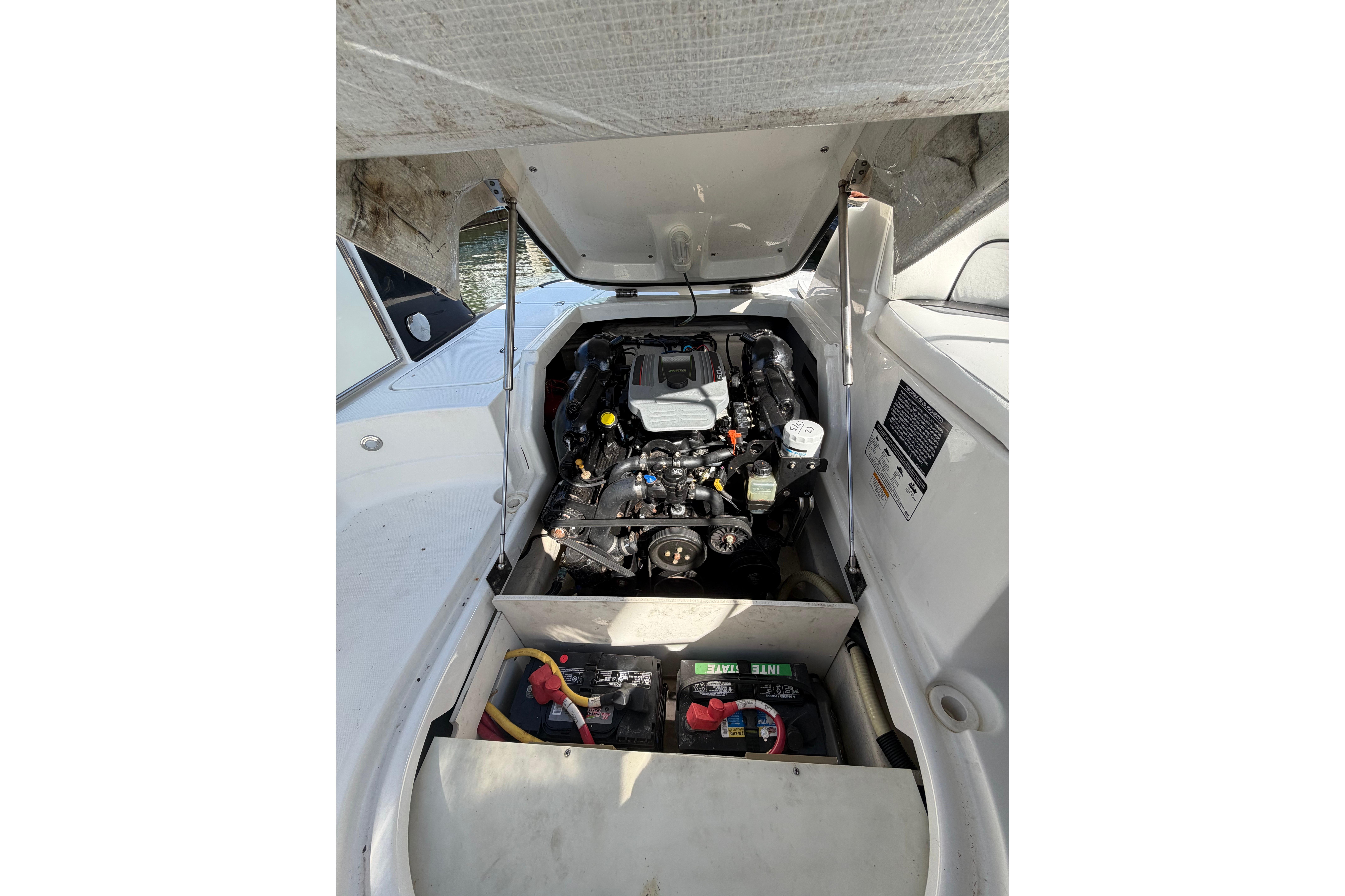 2015 Monterey 264FS boat engine compartment with visible battery and components.