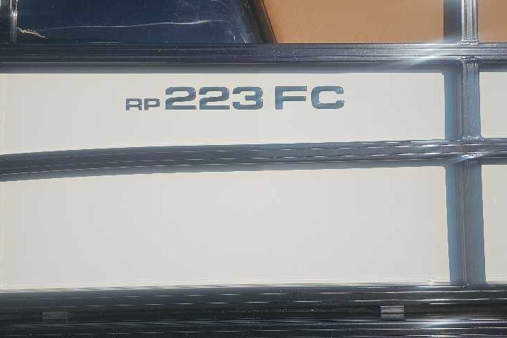 2026 Ranger 223FC boat model nameplate on a sleek exterior.