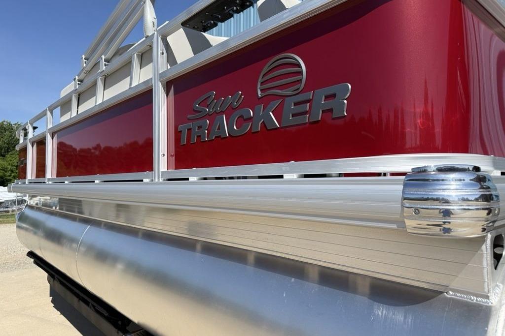 2026 Sun Tracker Bass Buggy 18 DLX pontoon boat with sleek red and silver design.