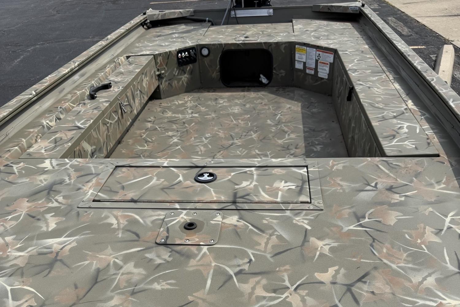 2025 Tracker Grizzly 1654 T Sportsman boat interior with camouflage design.