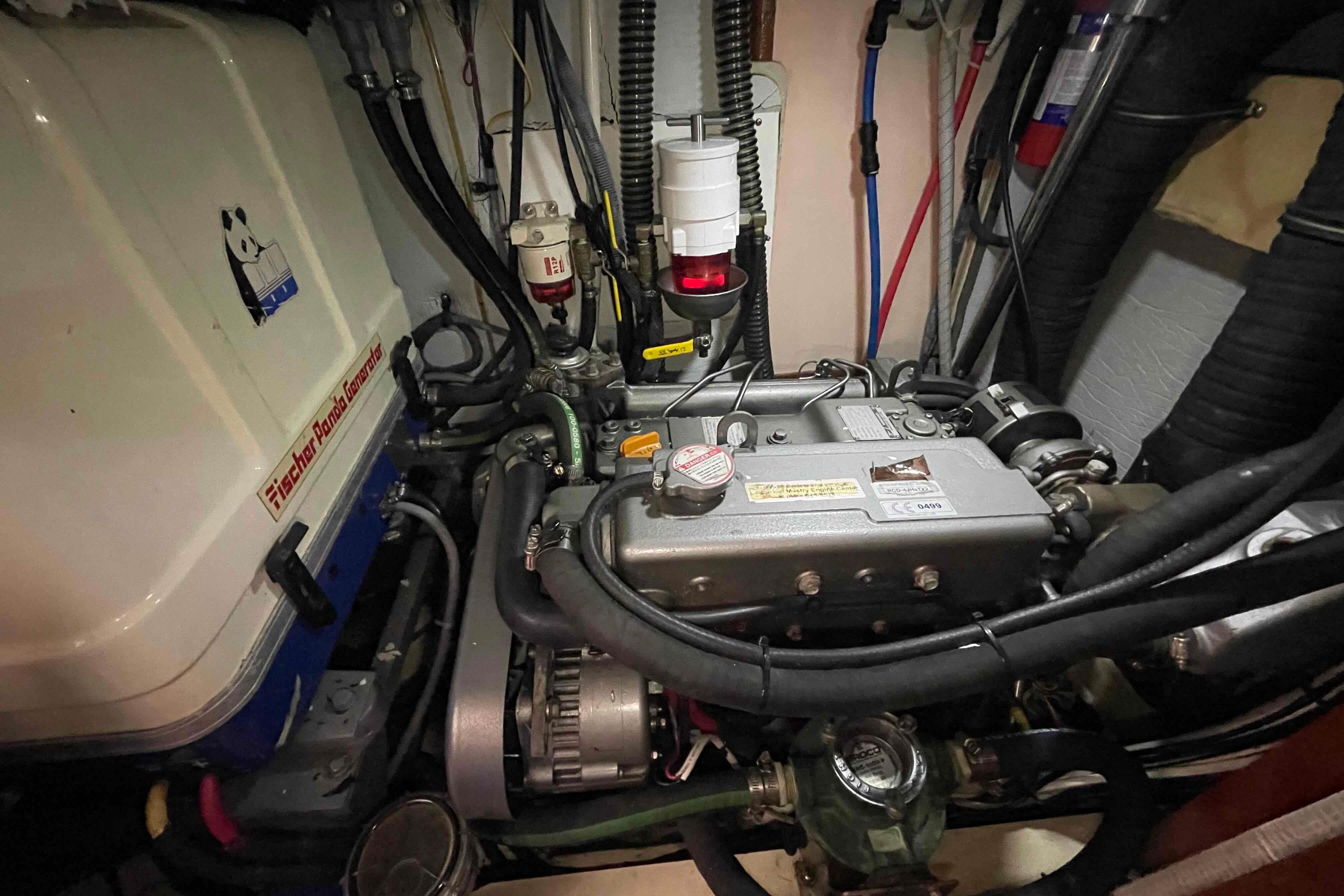 Engine room of 2010 Hunter 45 Center Cockpit with Fischer Panda generator.
