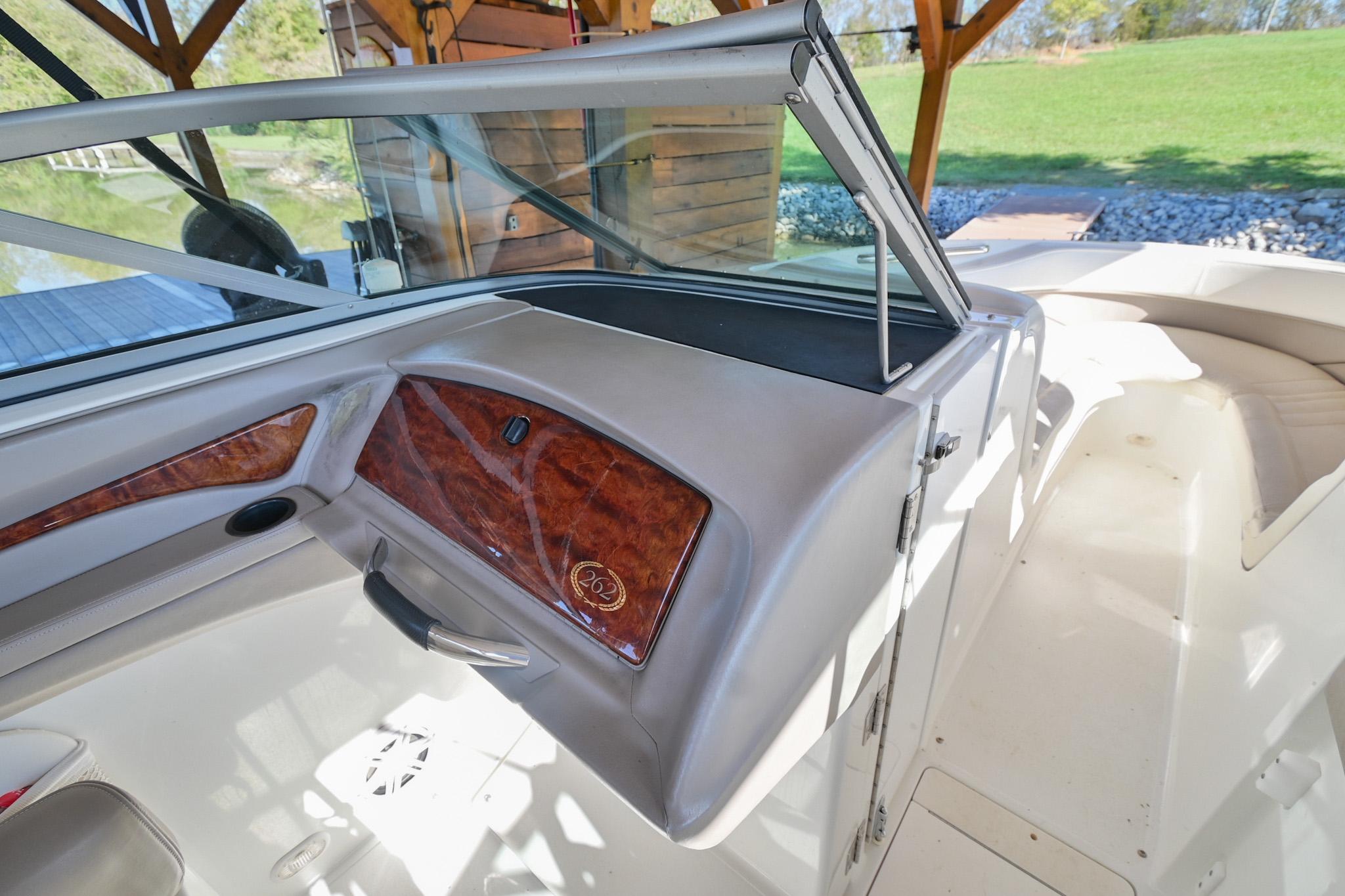 Interior view of a 2002 Cobalt 262 boat, featuring sleek design and wood accents.