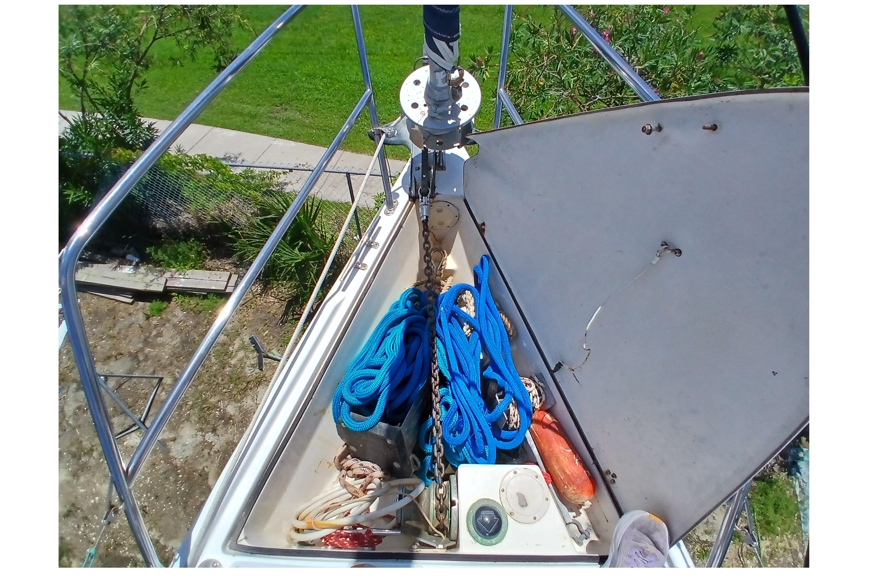 Anchor locker of a 1995 Catalina 42 MkII sailboat with ropes and equipment.