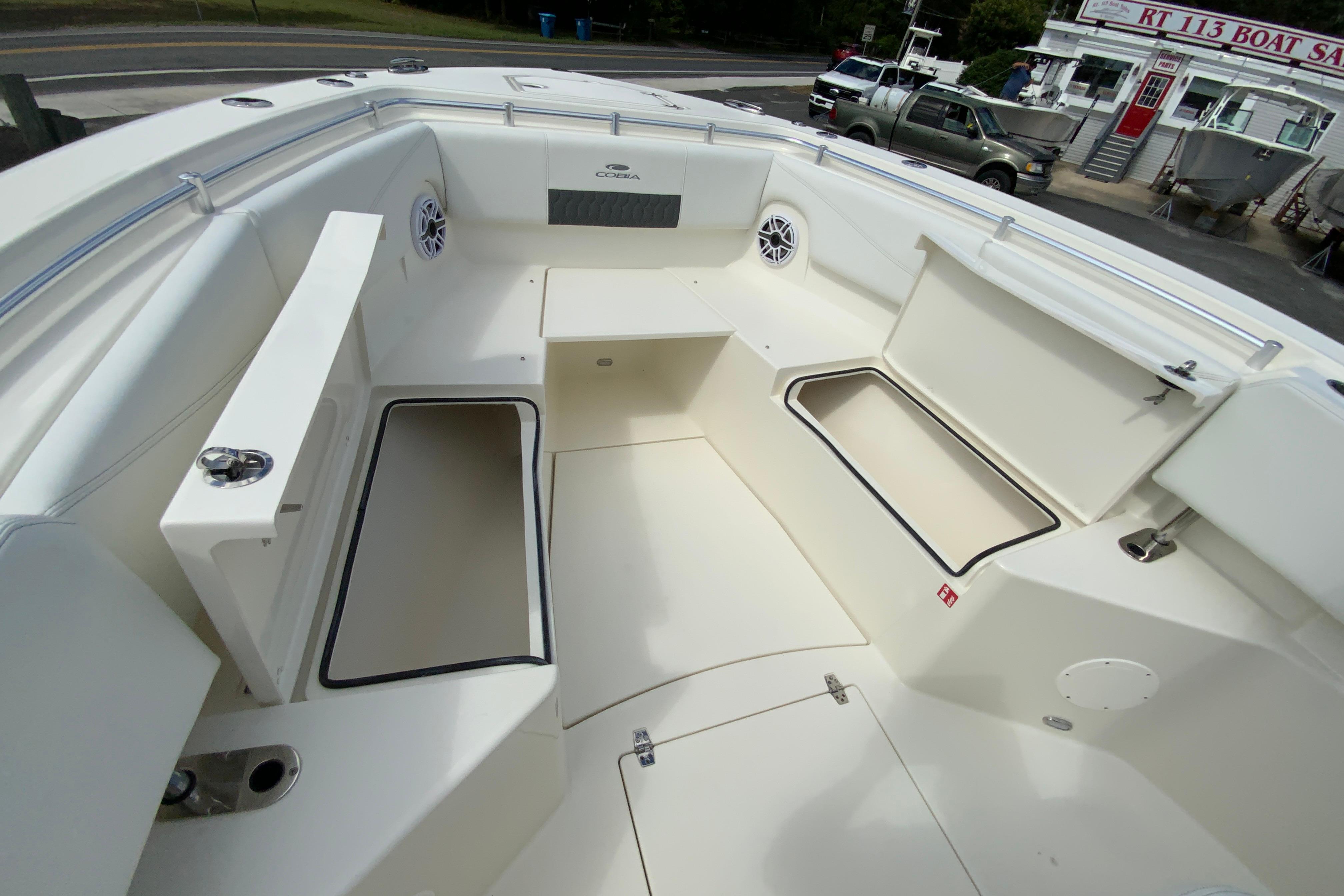 2027 Cobia 320 Center Console boat interior with spacious seating and storage compartments.