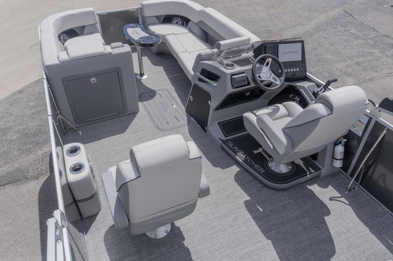 Luxurious interior of 2026 SunCatcher Elite 326 SL pontoon boat with modern seating and helm.