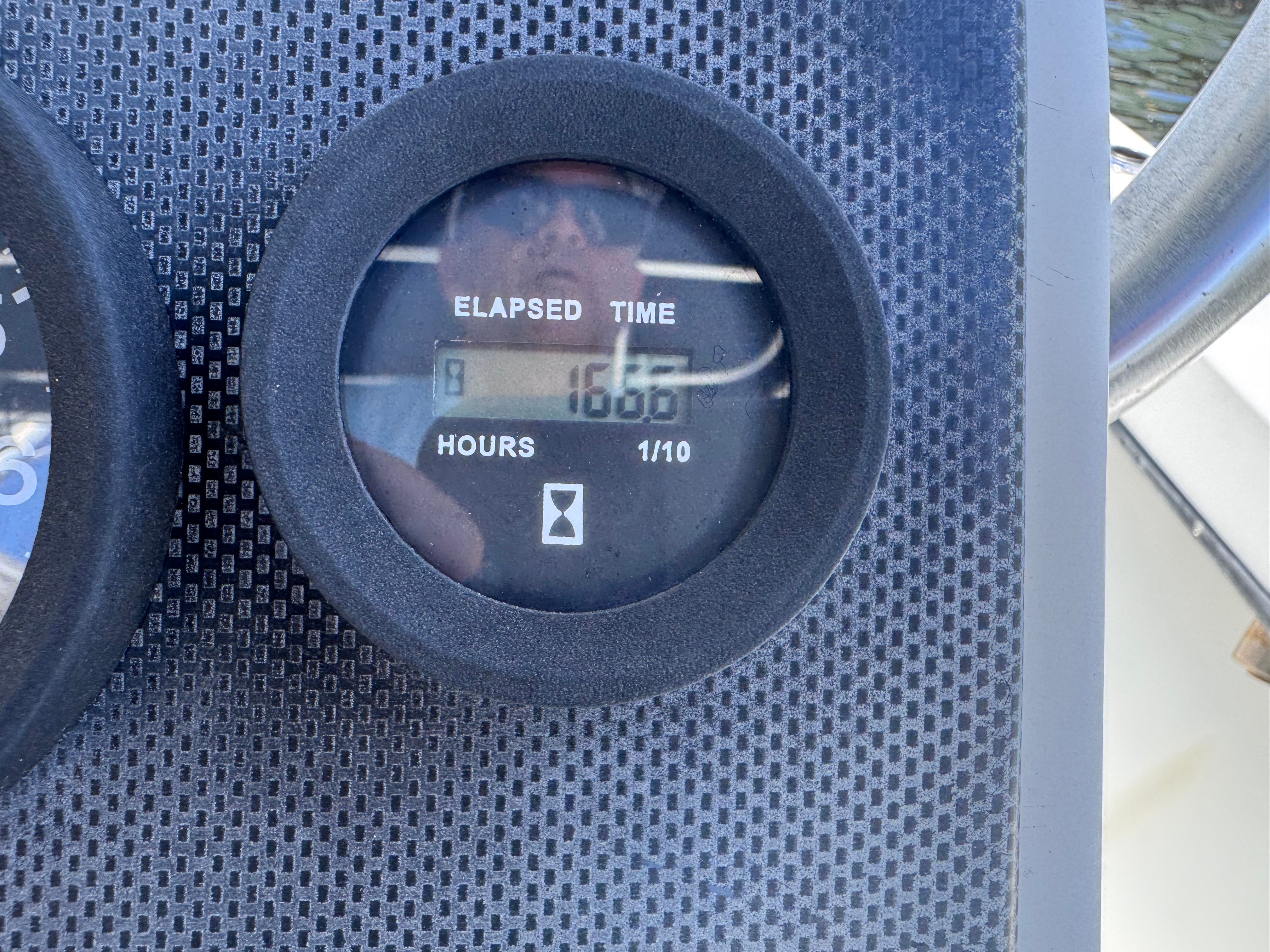 Hour meter on a 1998 Dusky 20.3 boat panel.