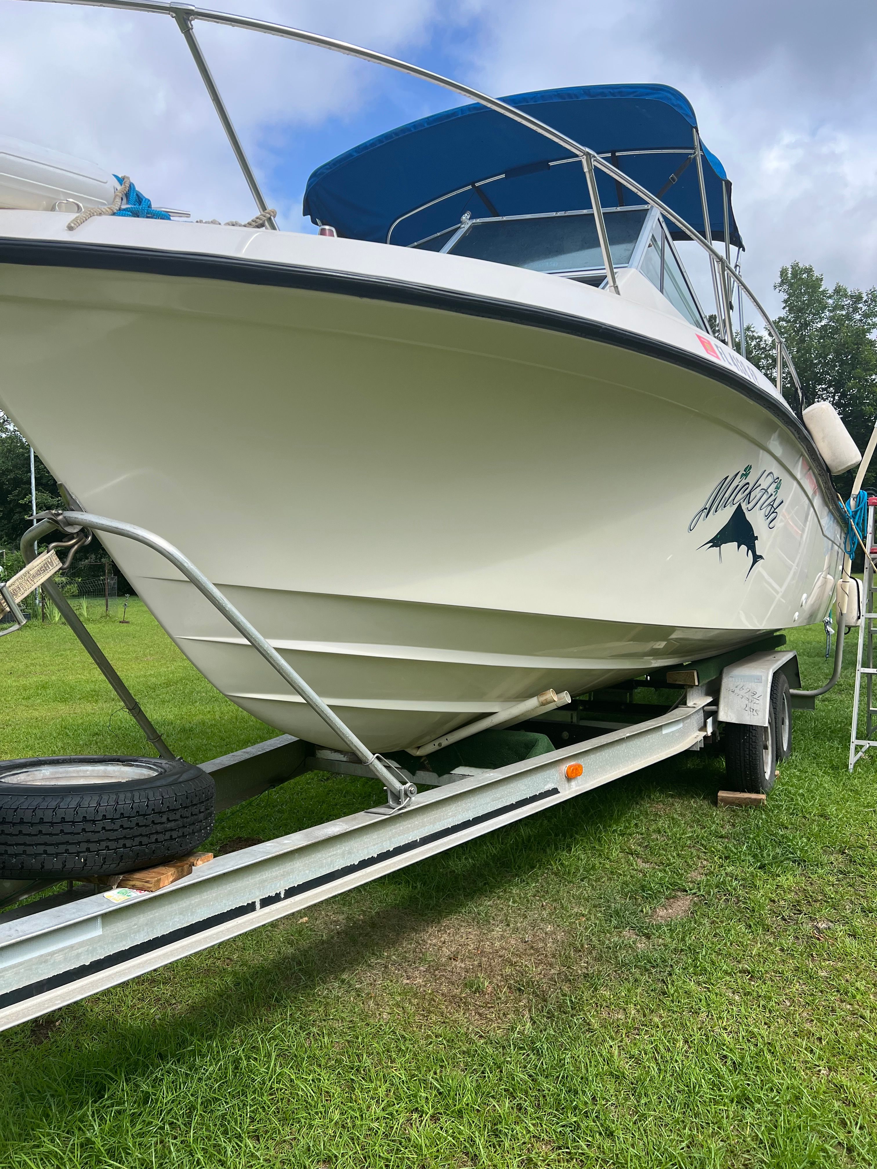 1987 Grady-White Gulfstream boat on trailer outdoors.