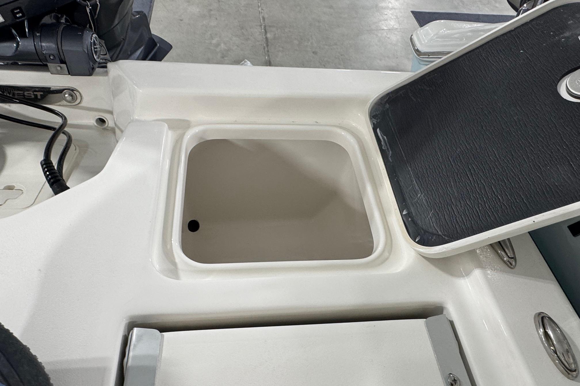 Open storage compartment on 2026 Key West 210 Bay Reef boat.