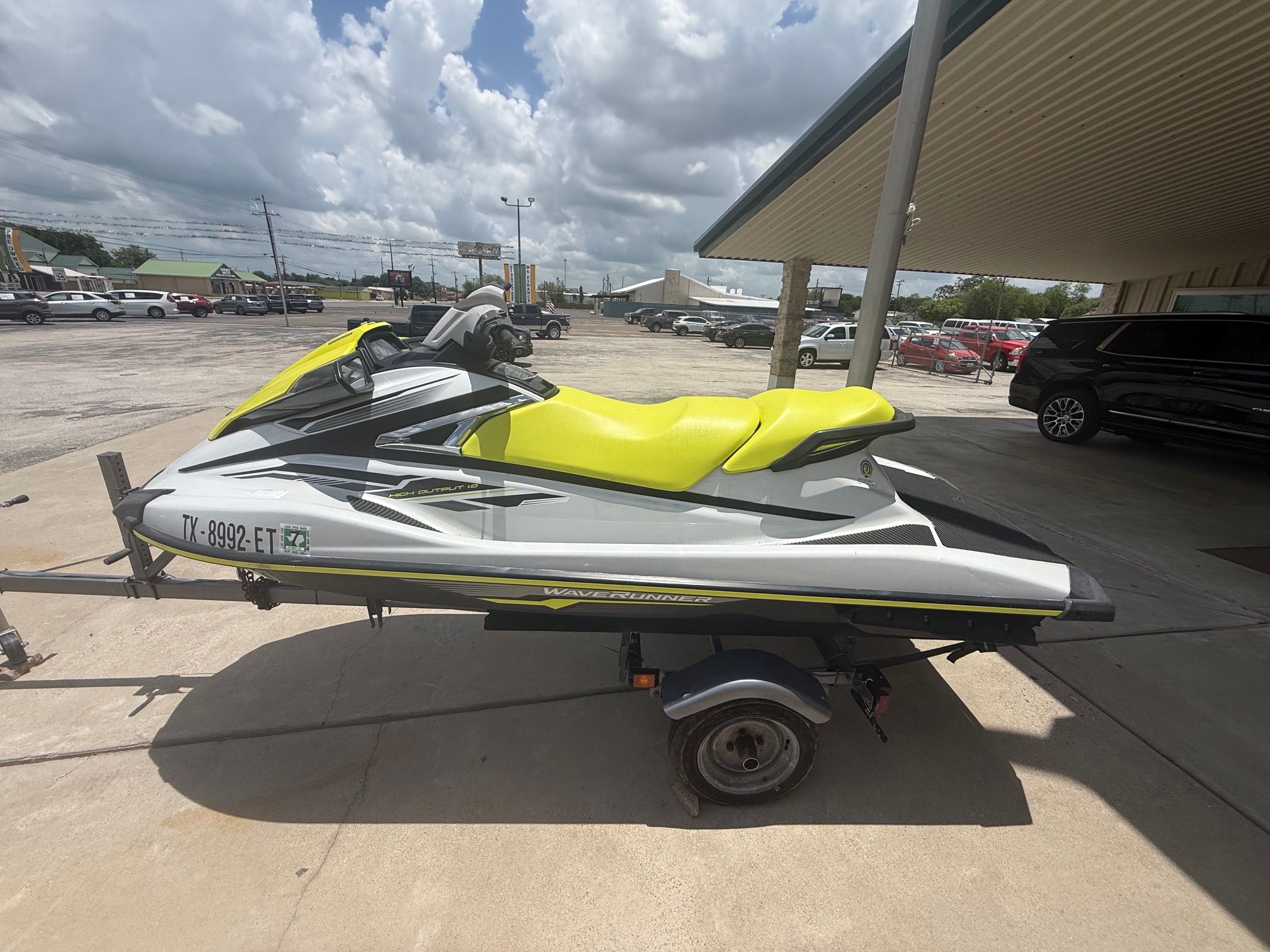 A 2019 Yamaha VX Cruiser jet ski with a yellow seat on a trailer.