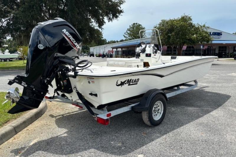2026 Mako Pro Skiff 17 CC boat on trailer with Mercury outboard motor.