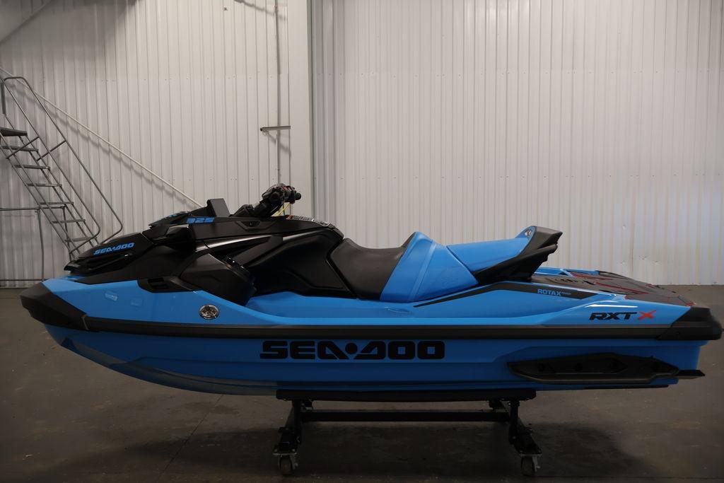 2026 Sea-Doo RXT-X 325 jet ski in blue, displayed indoors.