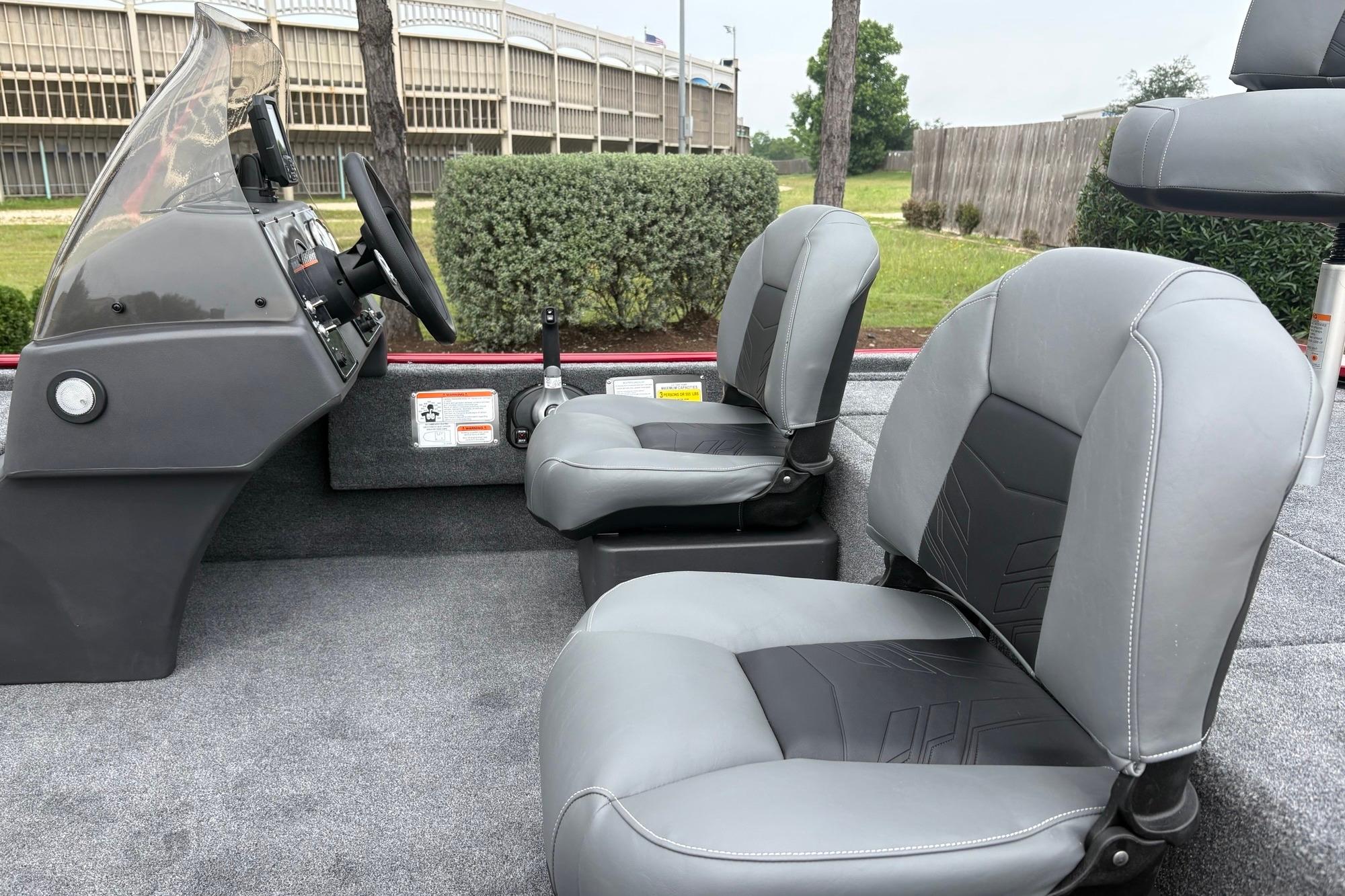 2026 Tracker Bass Tracker Classic XL boat interior with gray seating and steering console.