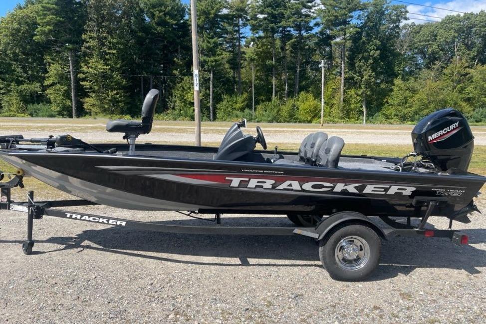 2026 Tracker Pro Team 175 Crappie Edition boat on trailer, parked outdoors.