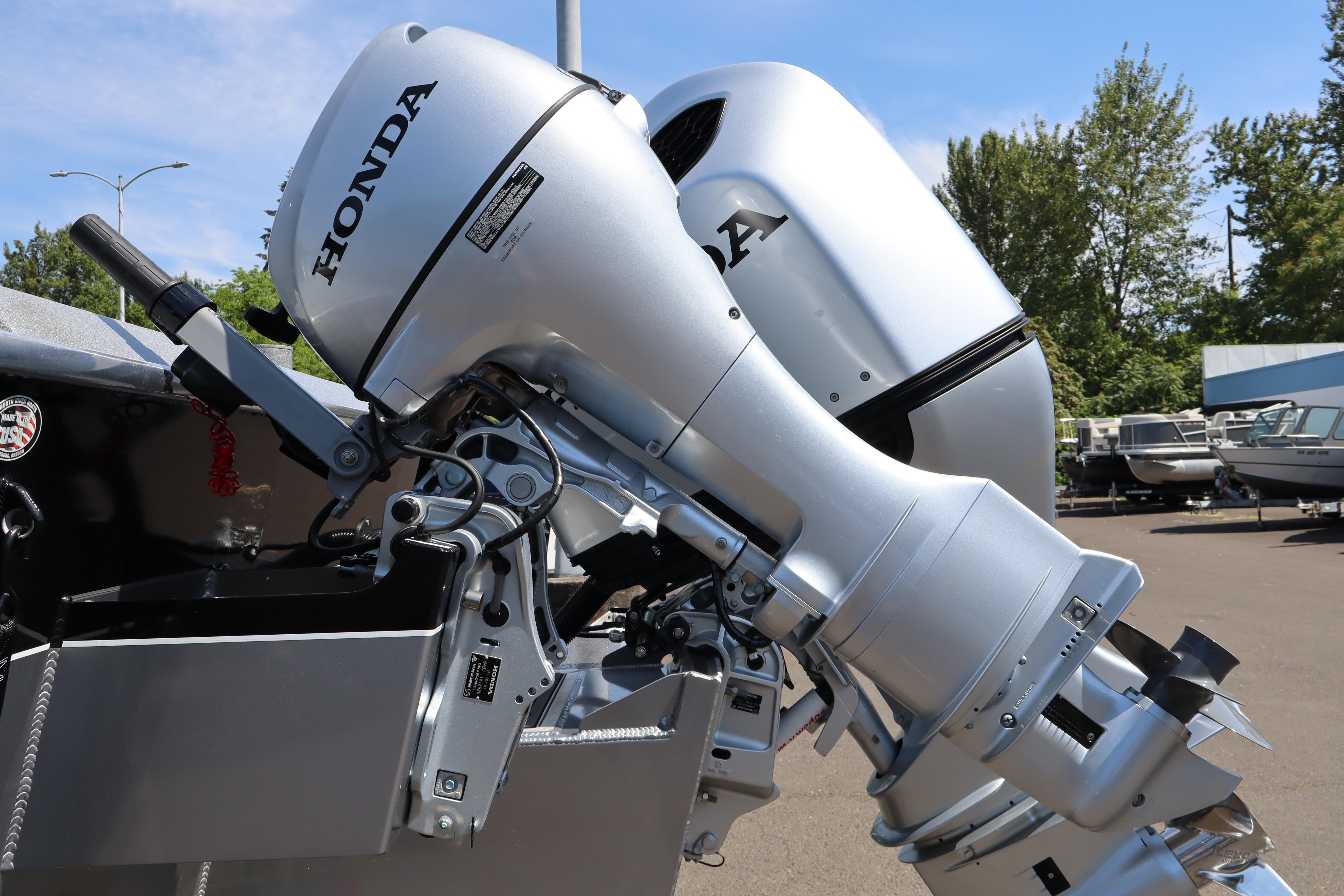 2025 NorthRiver SEAHAWK with dual Honda outboard motors, parked outdoors.