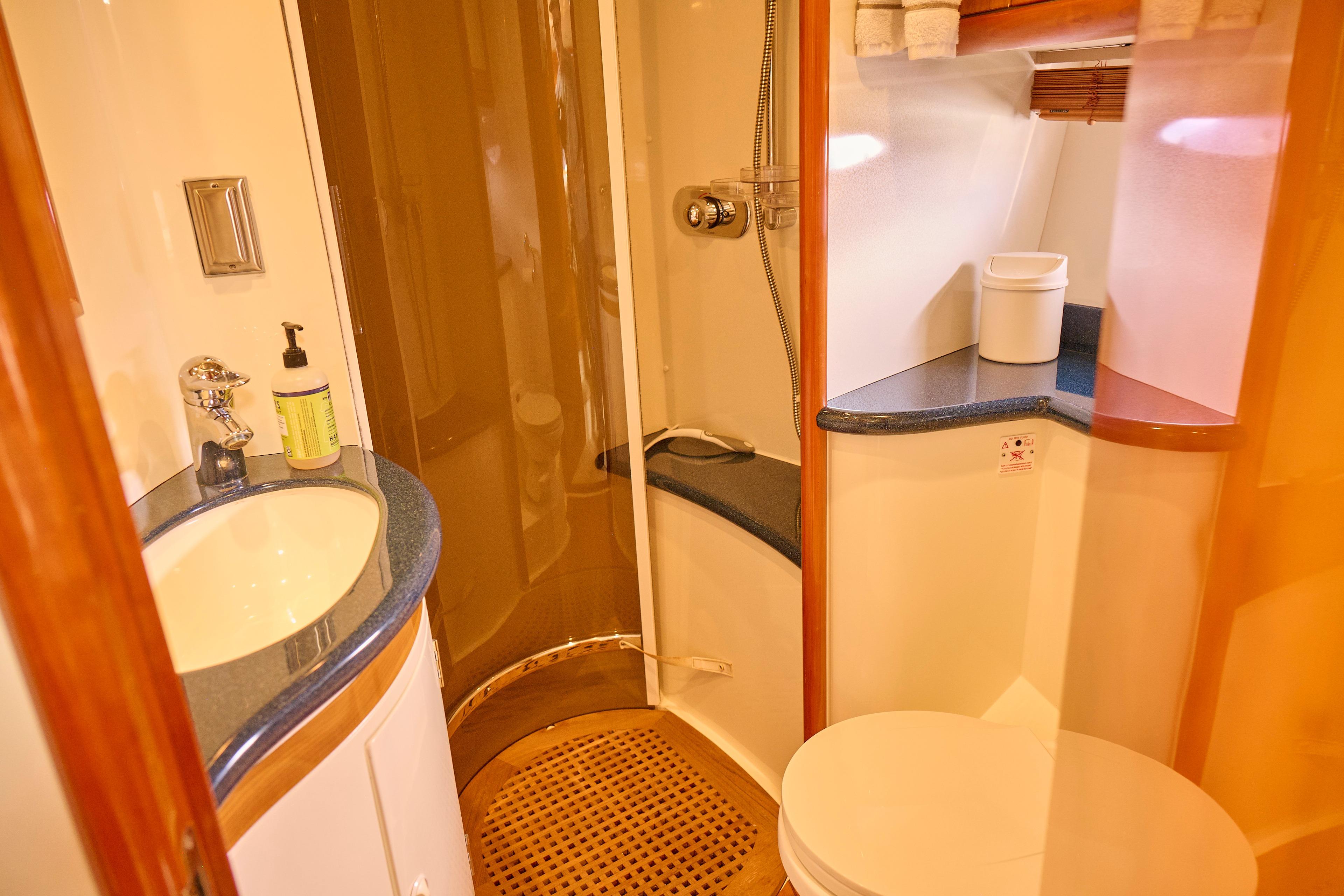 Luxurious bathroom in 2000 Sunseeker Camargue 50 yacht with modern amenities.