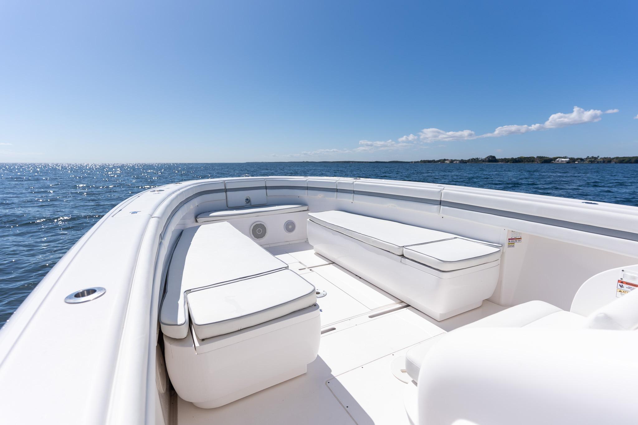 2015 Intrepid 400 Center Console boat on open water, clear sky, spacious seating.