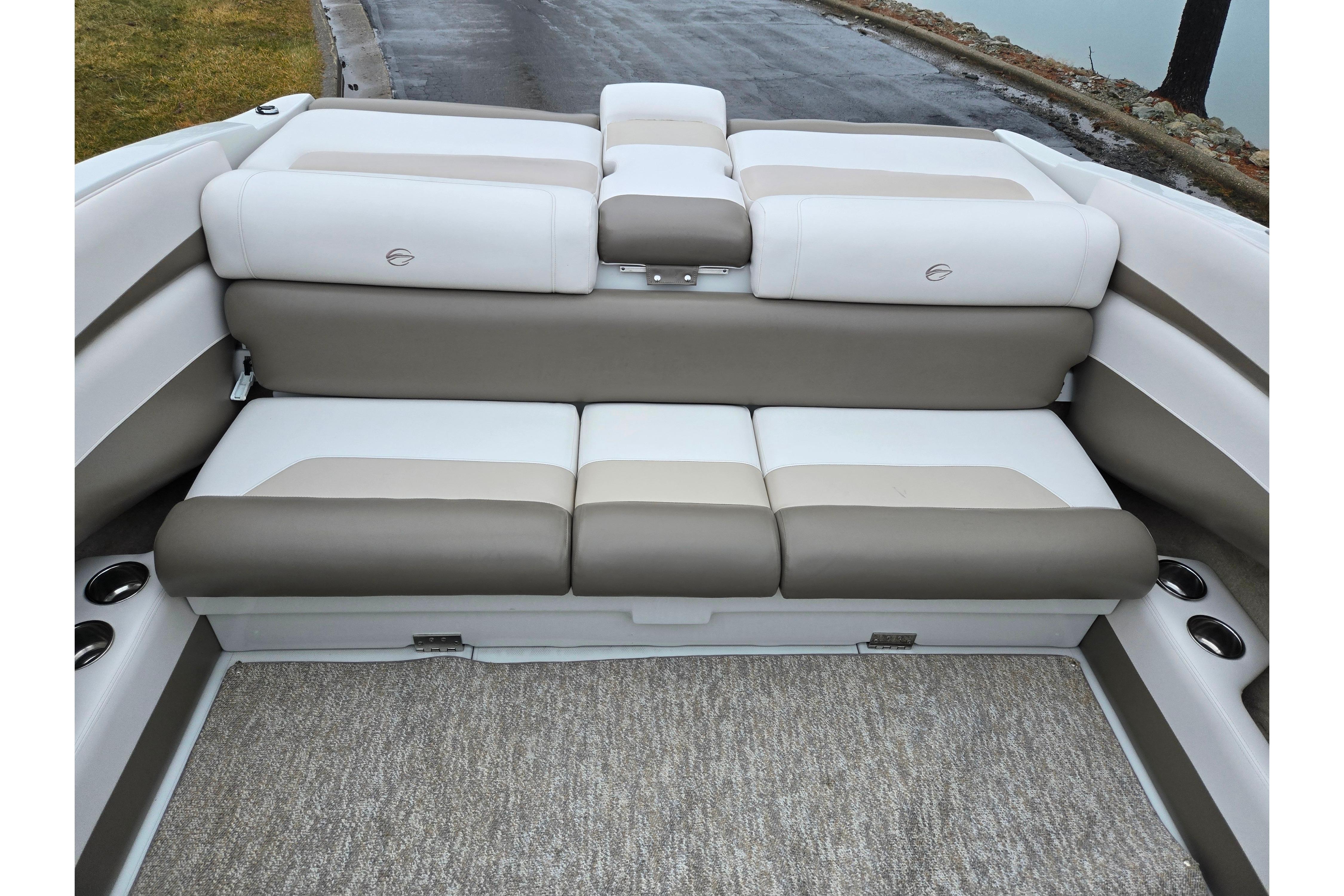 2012 Crownline 235 SS boat interior with beige and white cushioned seating.