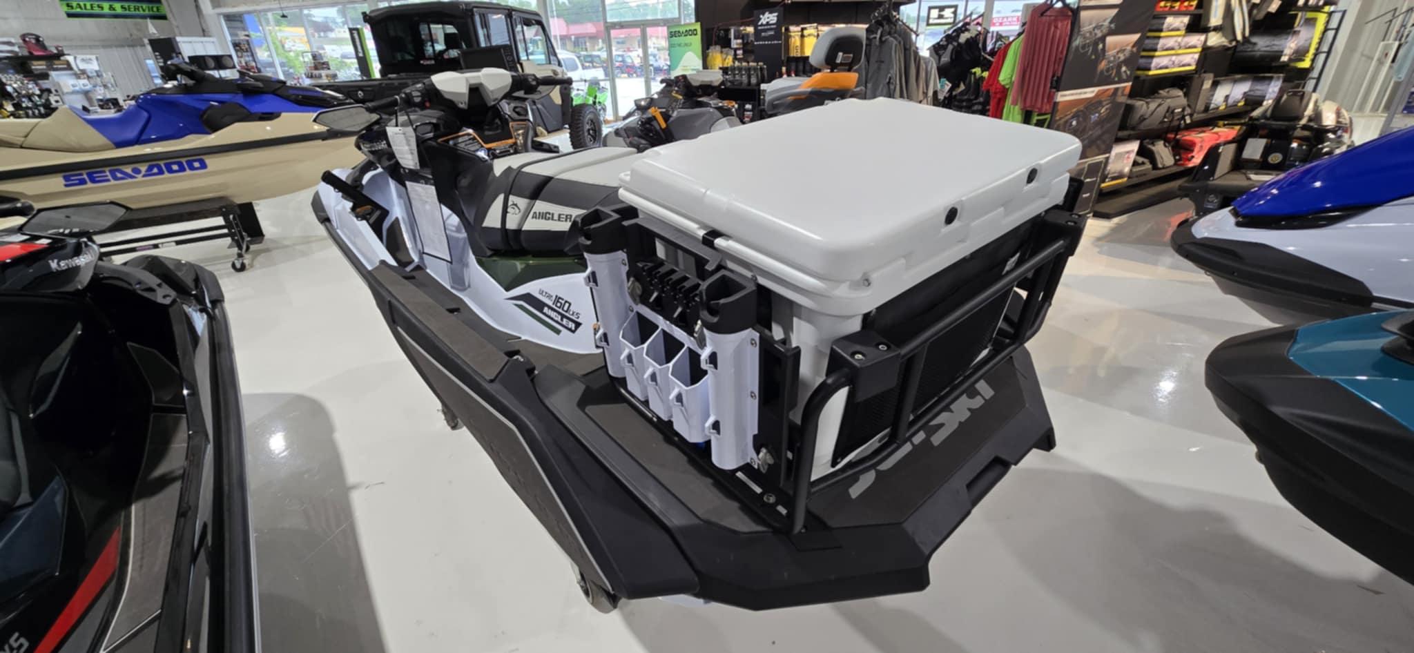 2025 Kawasaki Jetski Ultra 160 LX-S Angler in showroom, featuring fishing gear storage.