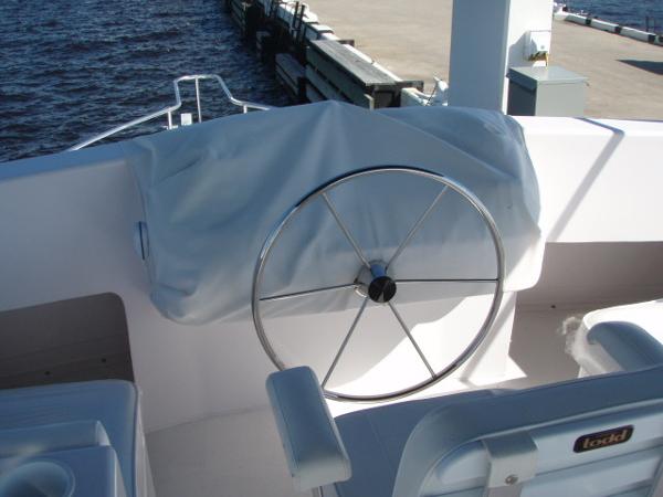2025 Great Harbour N40 yacht helm with covered controls and steering wheel.