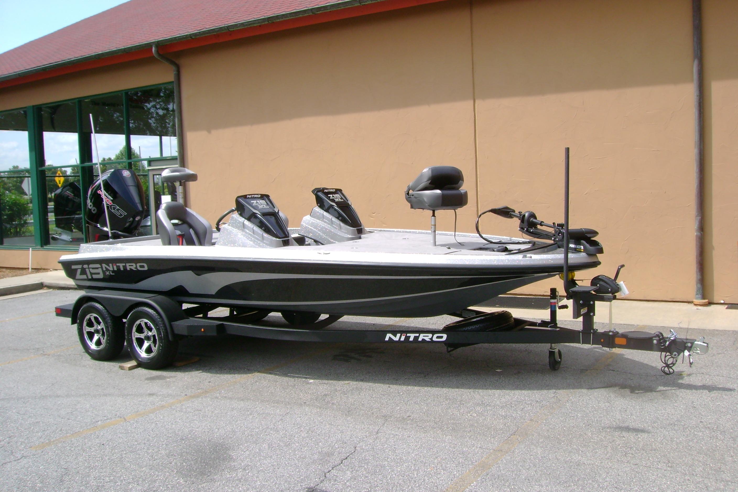 2026 Nitro Z19 XL fishing boat on trailer, parked outside a building.
