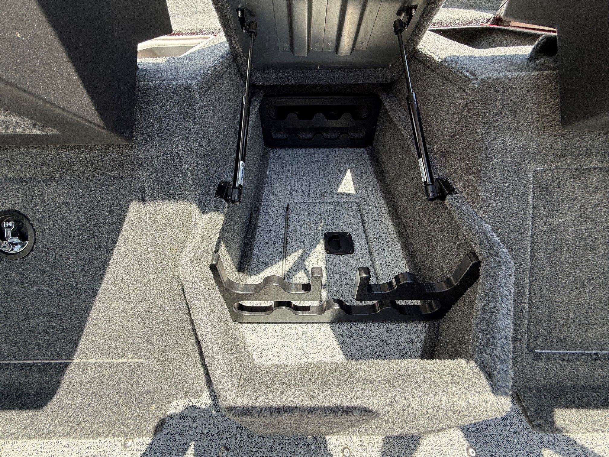 Interior view of 2024 Tracker Pro Guide V175 with storage compartment.