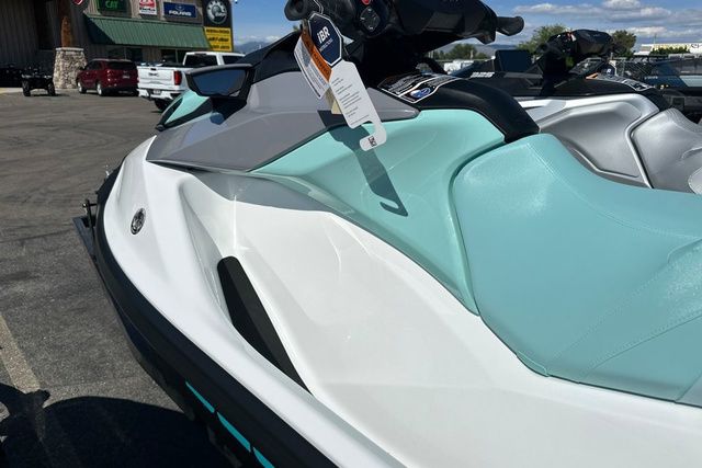 2026 Sea-Doo PWC GTI 130 WH IBR 26 STD with turquoise seat in a parking lot.