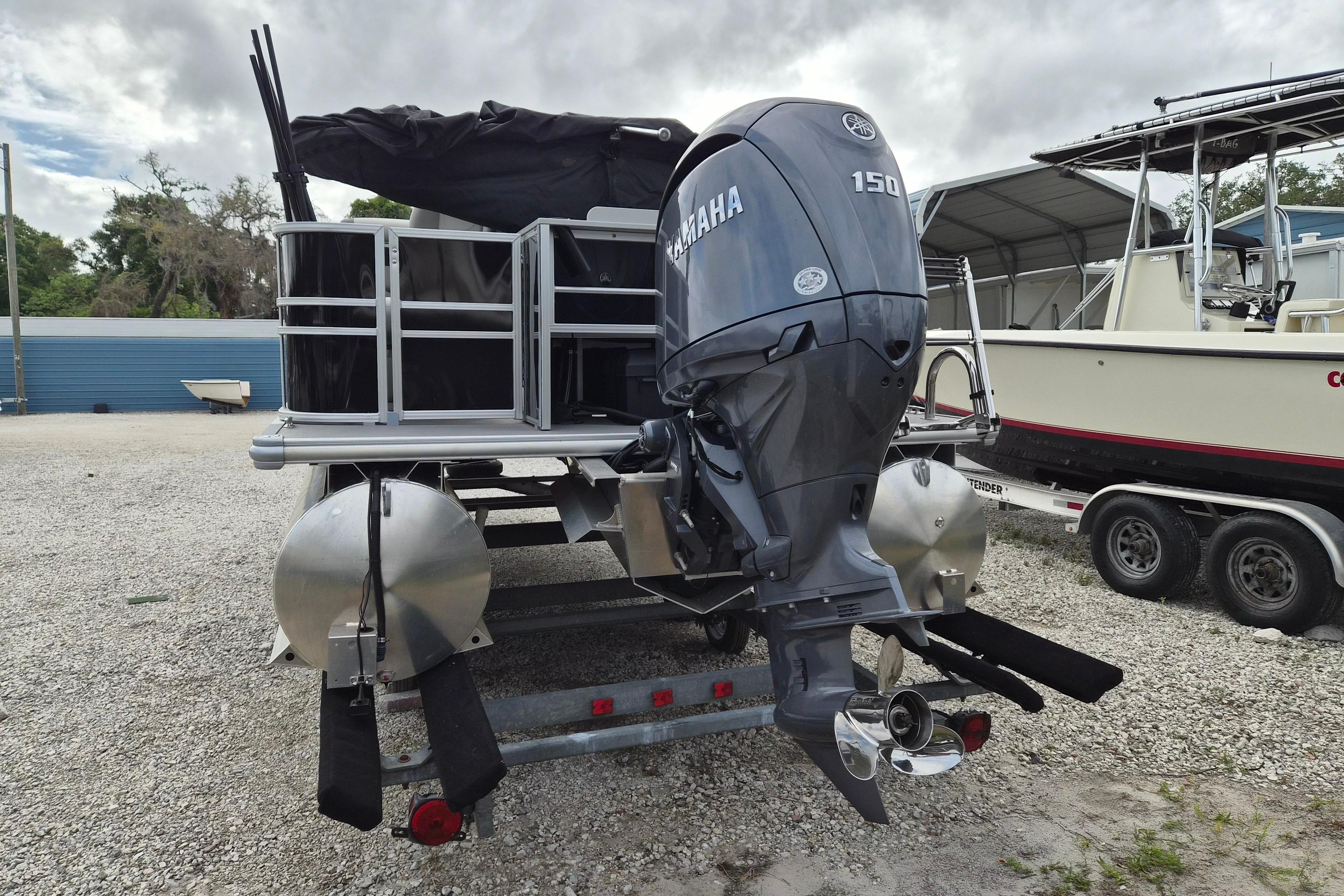 2025 Sylvan Mirage Fish 8522 Party Fish 4.0 pontoon boat with Yamaha 150 outboard motor.