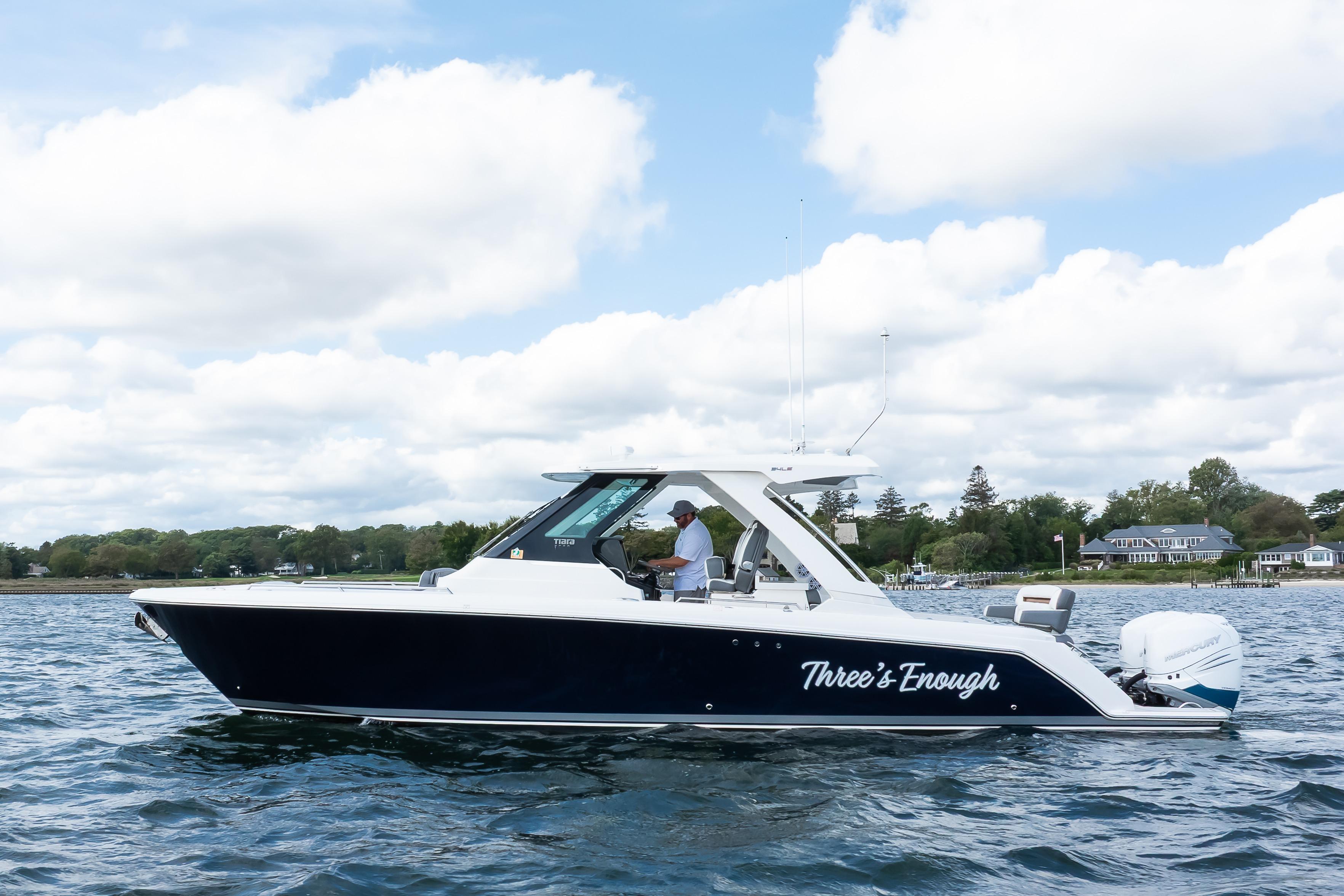 2020 Tiara Sport 34 LS boat on water, side view, with scenic background.