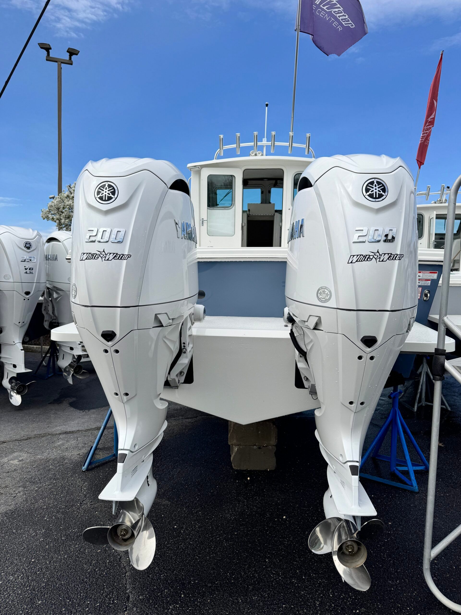 The image shows a Regal 26 Express boat with two Yamaha outboard engines.