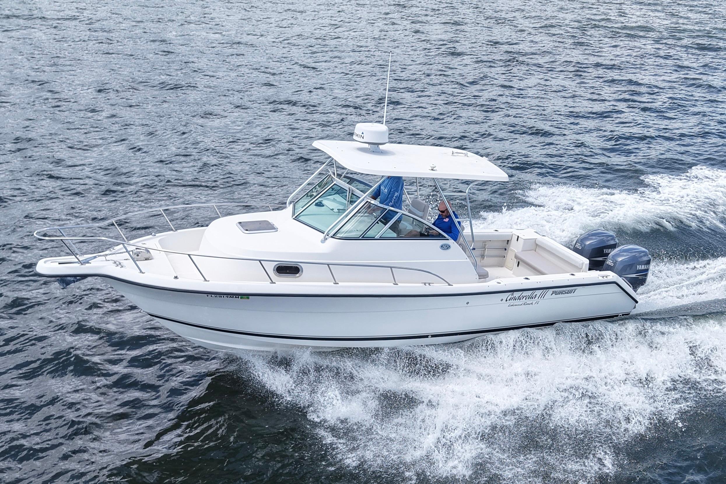2004 Pursuit 2870 Walkaround boat cruising on open water with twin engines.