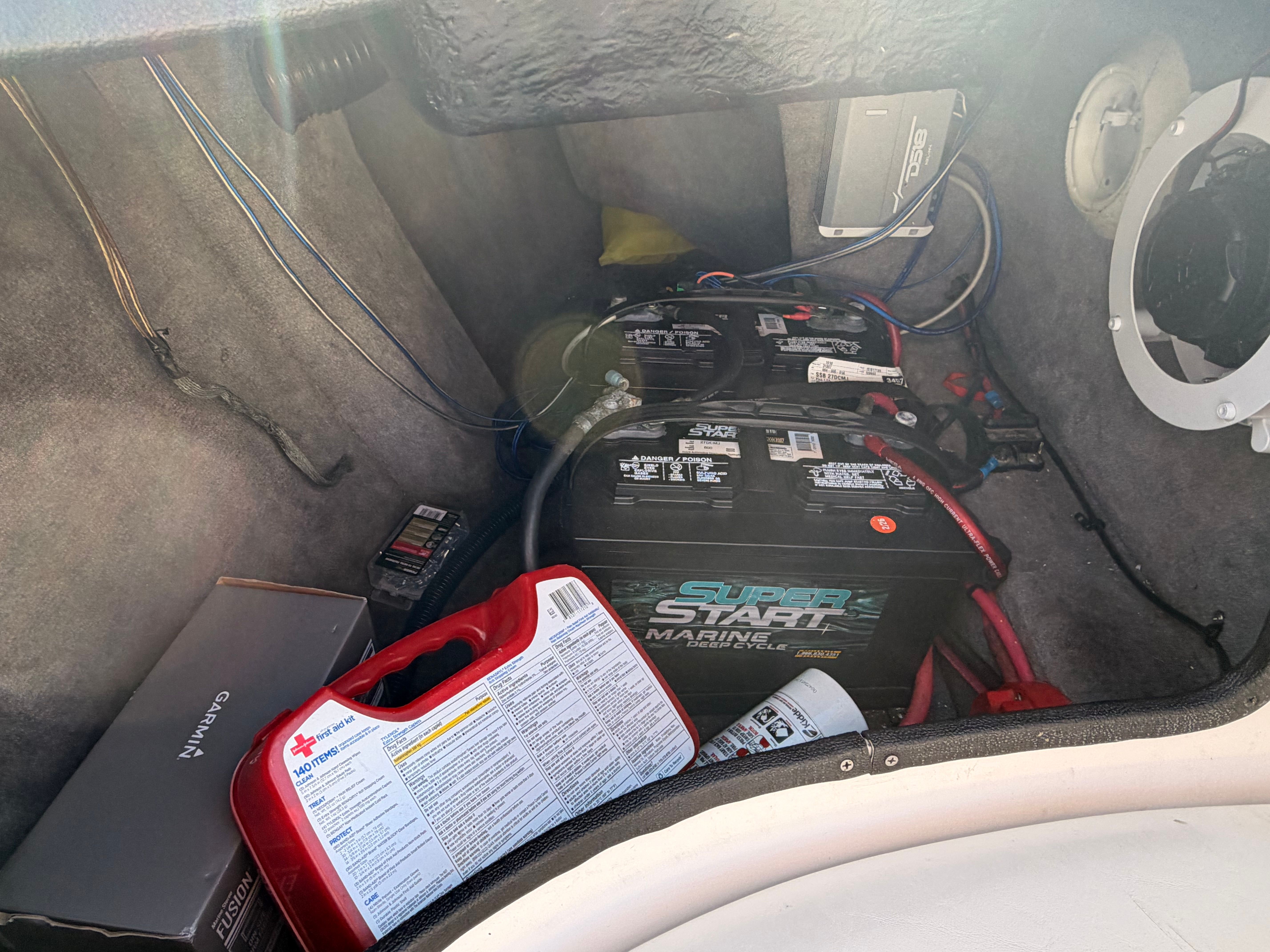 Battery compartment of a 2004 Supra Launch SSV with accessories.
