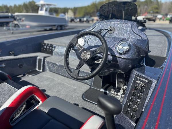 2025 Phoenix 920 Elite boat interior with steering wheel and control panel.