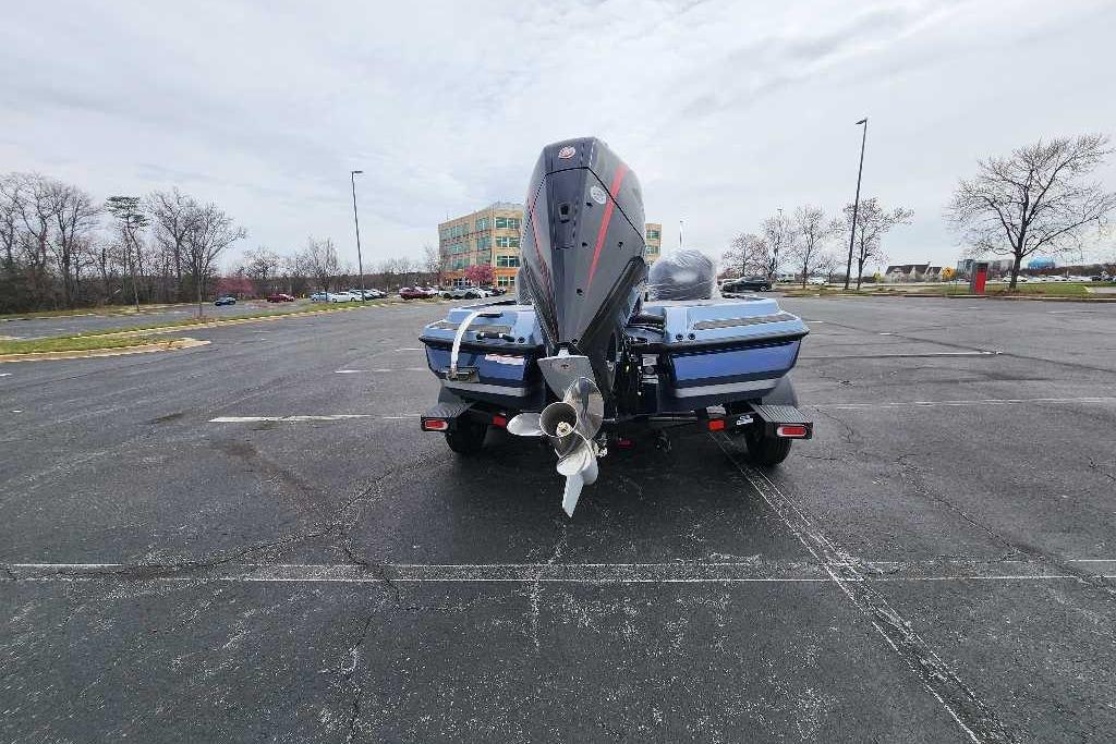 2026 Nitro Z20 XL boat on trailer in parking lot, rear view.